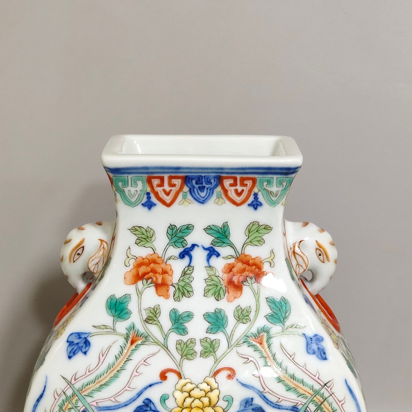 Qing Dynasty Qianlong blue-and-white and polychrome square vase with elephant-head handles