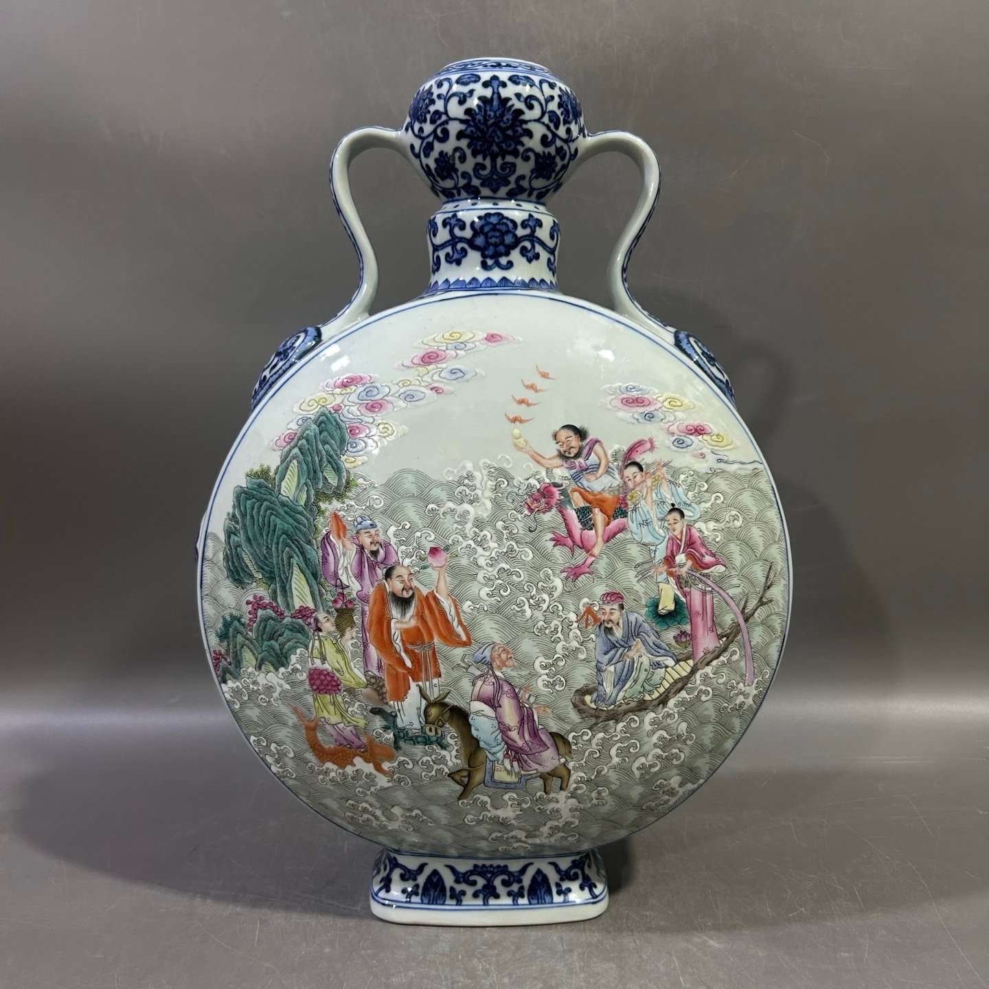 Qing Dynasty Qianlong blue and white lotus lotus pastel Eight Immortals holding the moon vase