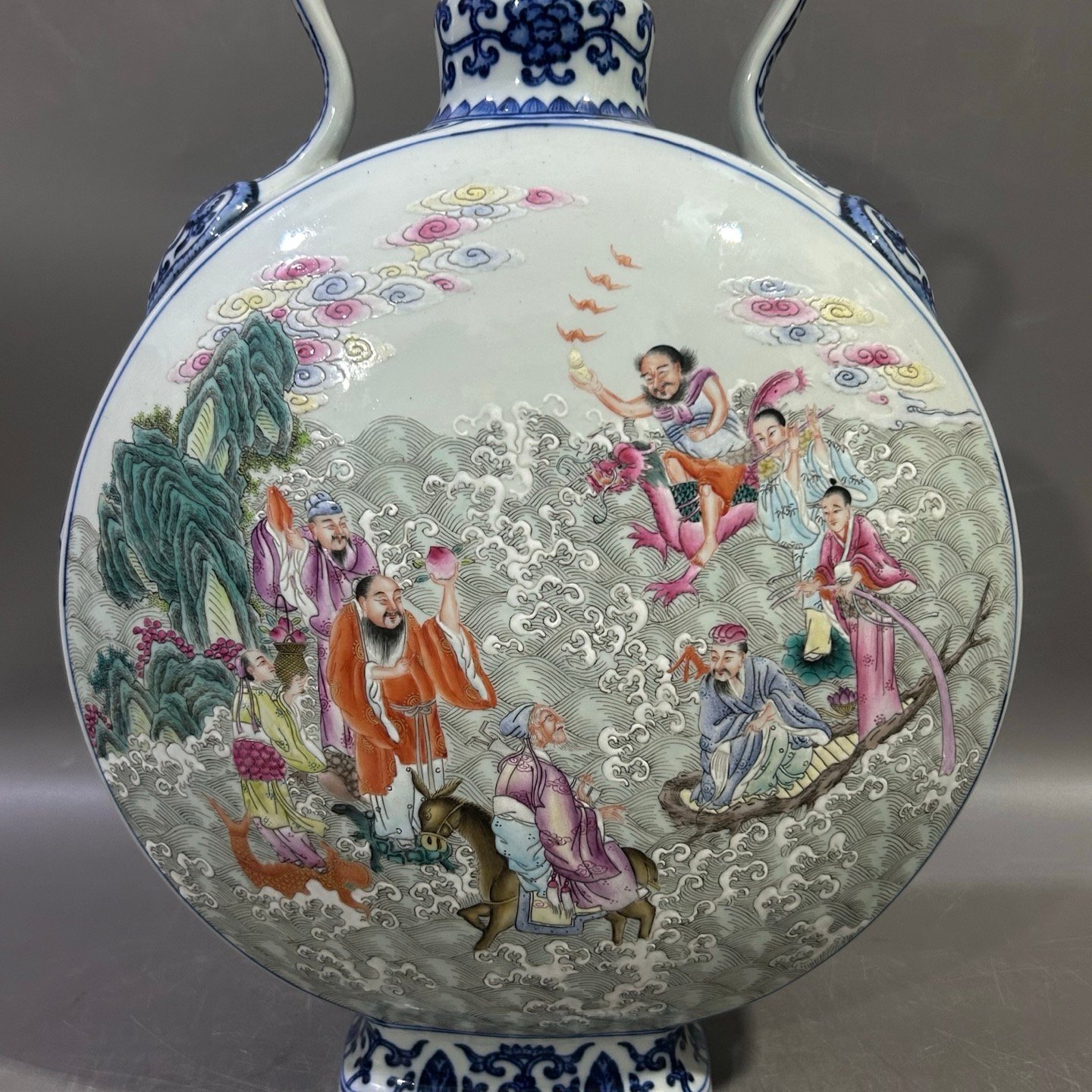 Qing Dynasty Qianlong blue and white lotus lotus pastel Eight Immortals holding the moon vase