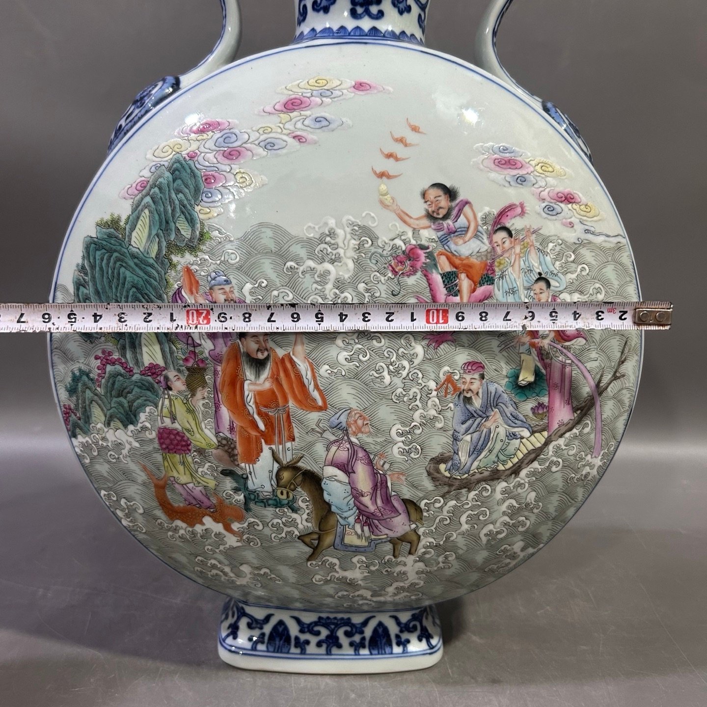 Qing Dynasty Qianlong blue and white lotus lotus pastel Eight Immortals holding the moon vase