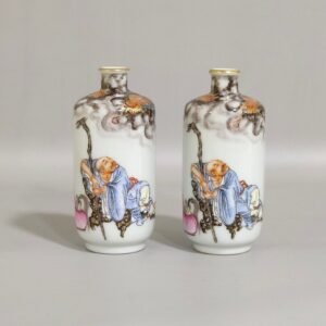 Qing Dynasty Qianlong ink color subduing dragon and Arhat snuff bottle