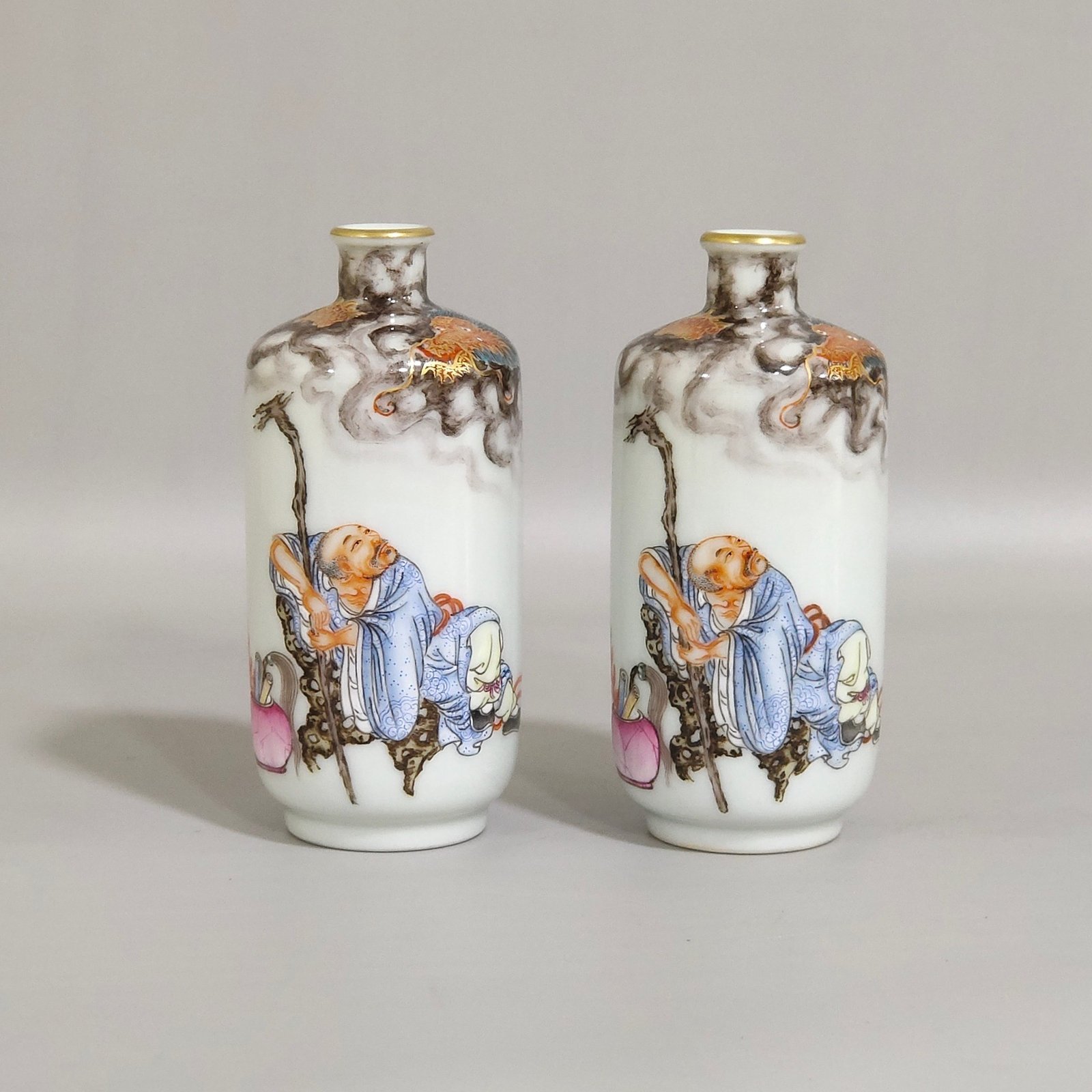 Qing Dynasty Qianlong ink color subduing dragon and Arhat snuff bottle