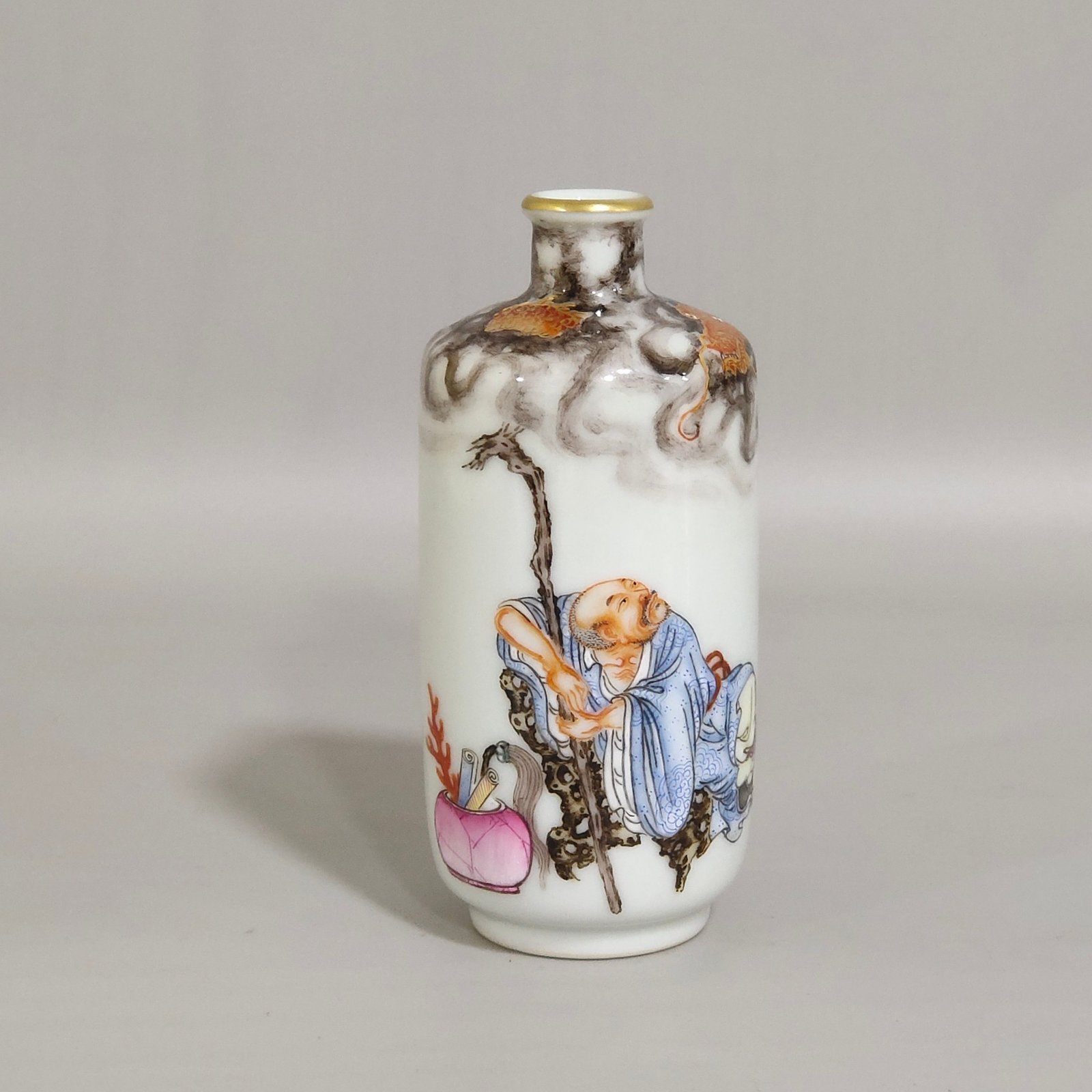Qing Dynasty Qianlong ink color subduing dragon and Arhat snuff bottle