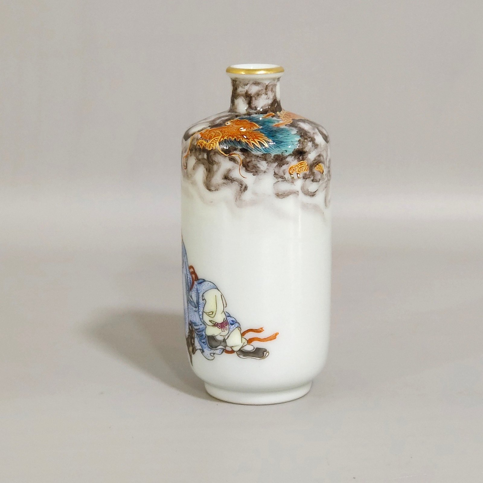 Qing Dynasty Qianlong ink color subduing dragon and Arhat snuff bottle