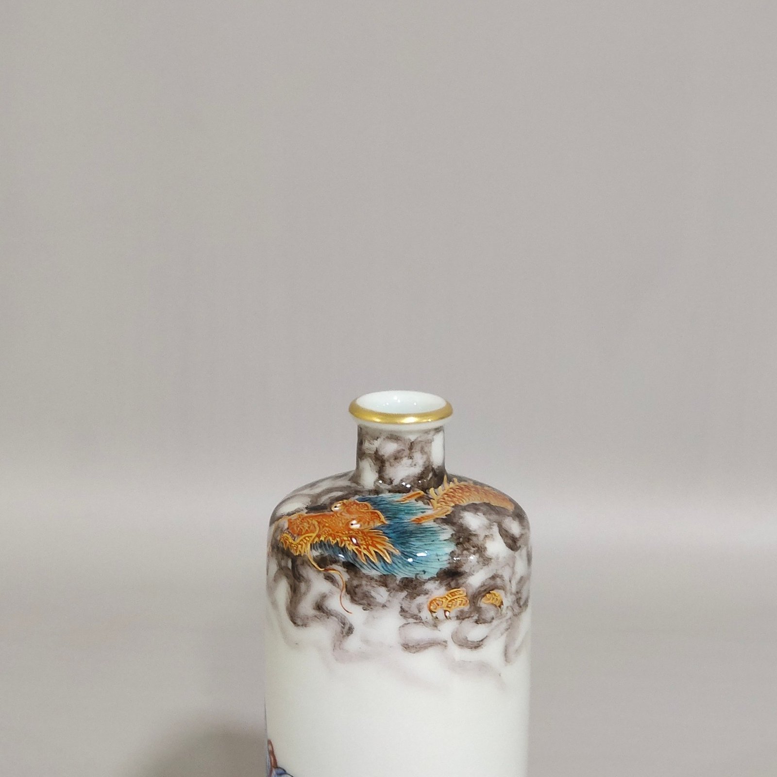 Qing Dynasty Qianlong ink color subduing dragon and Arhat snuff bottle
