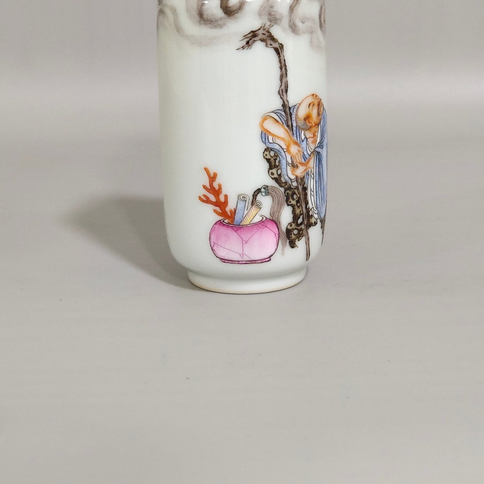 Qing Dynasty Qianlong ink color subduing dragon and Arhat snuff bottle