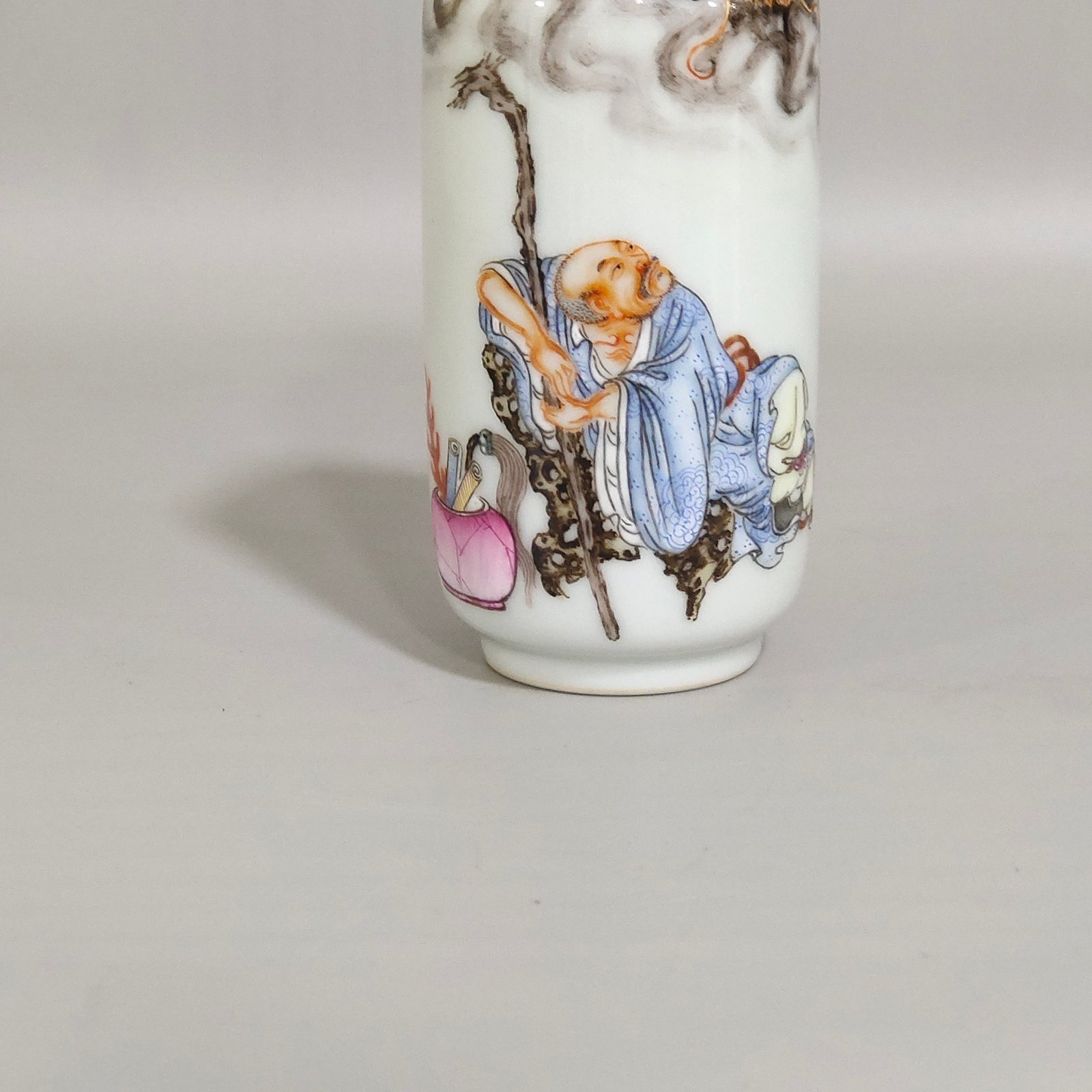 Qing Dynasty Qianlong ink color subduing dragon and Arhat snuff bottle