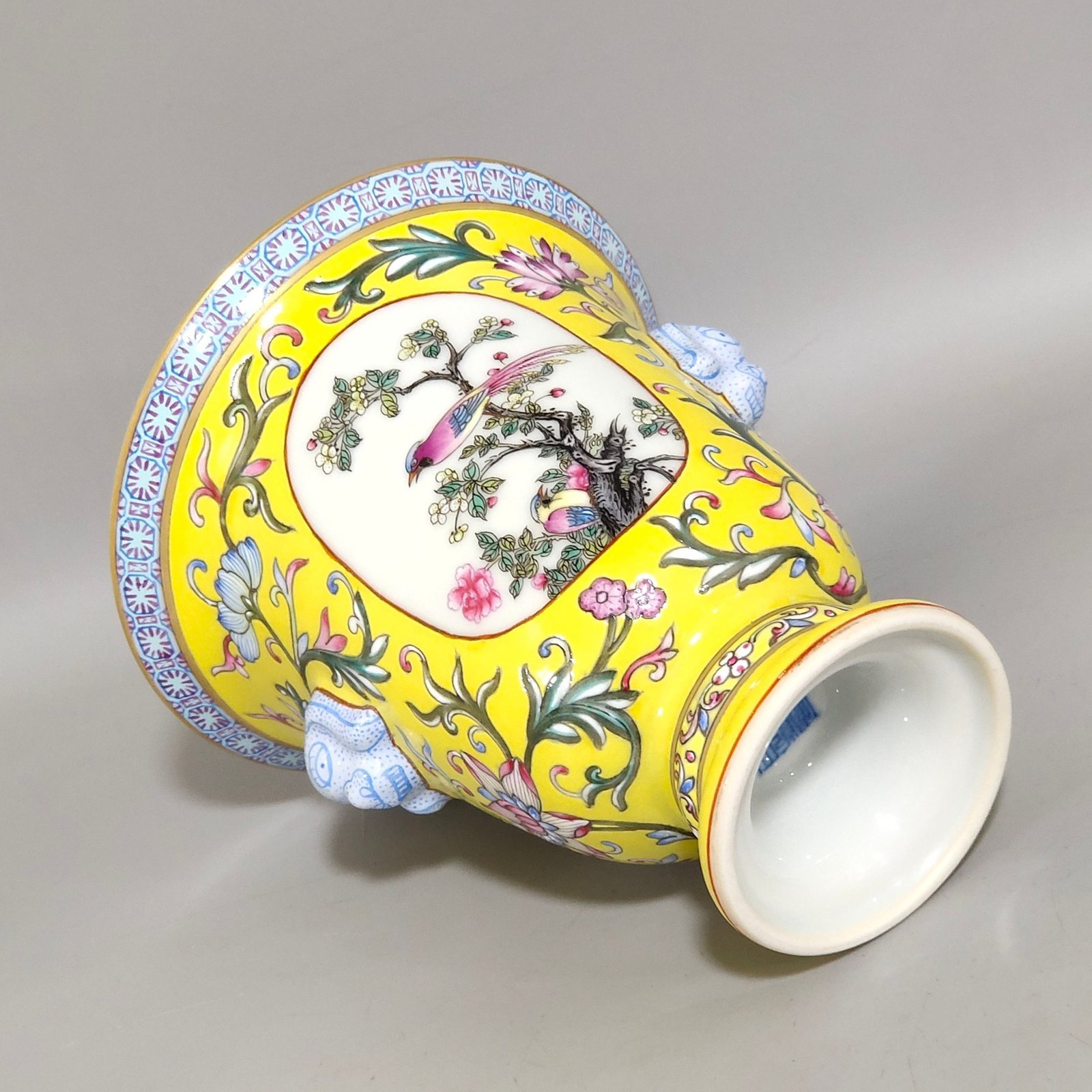 Qing Dynasty Qianlong lemon yellow window flower and bird goblet with two ears