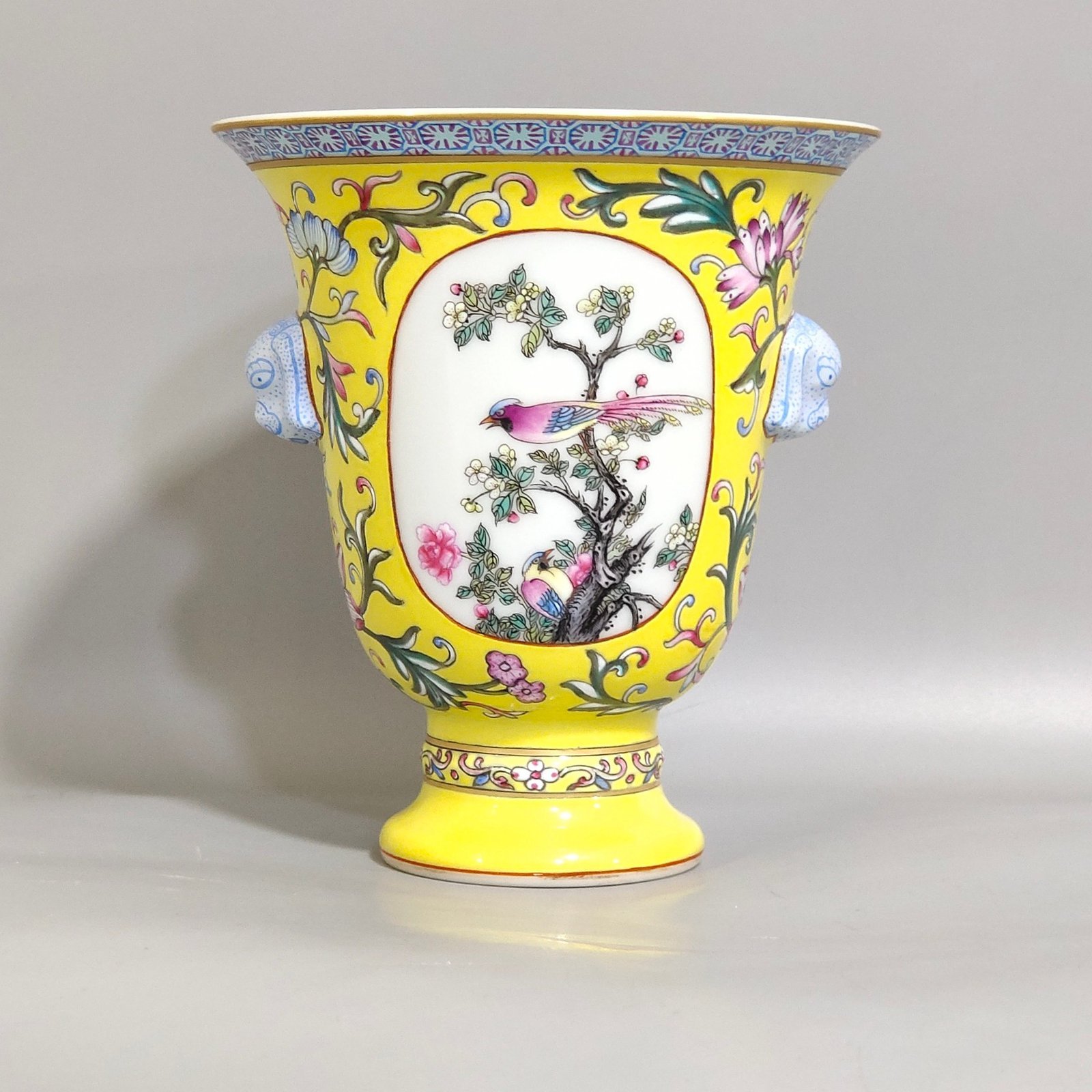 Qing Dynasty Qianlong lemon yellow window flower and bird goblet with two ears