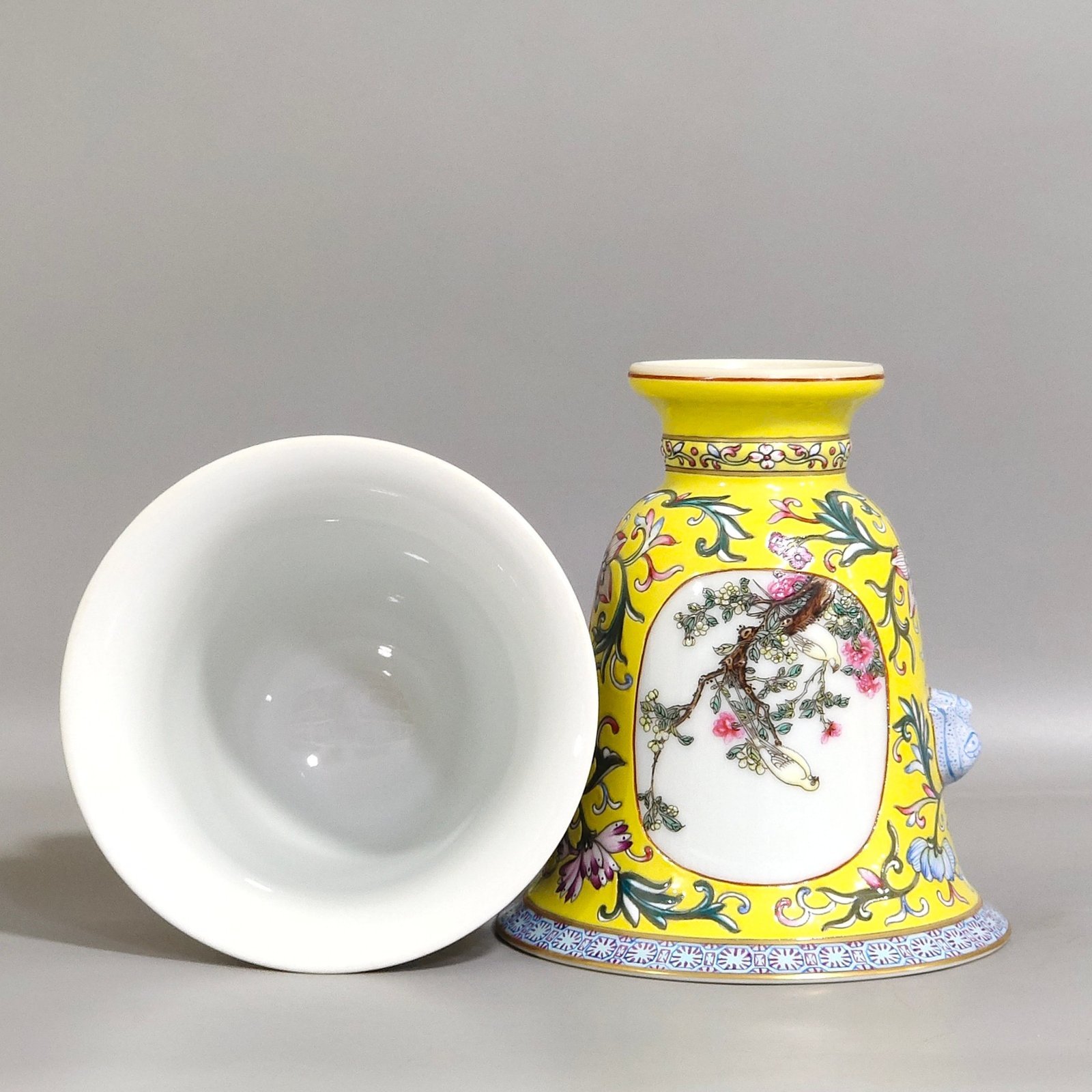 Qing Dynasty Qianlong lemon yellow window flower and bird goblet with two ears