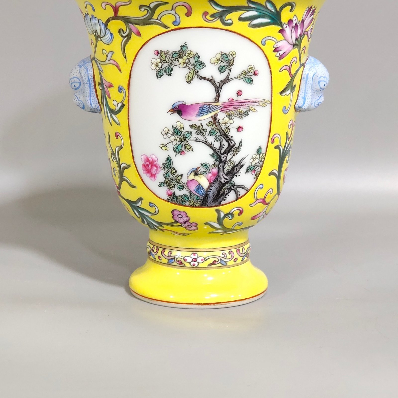 Qing Dynasty Qianlong lemon yellow window flower and bird goblet with two ears