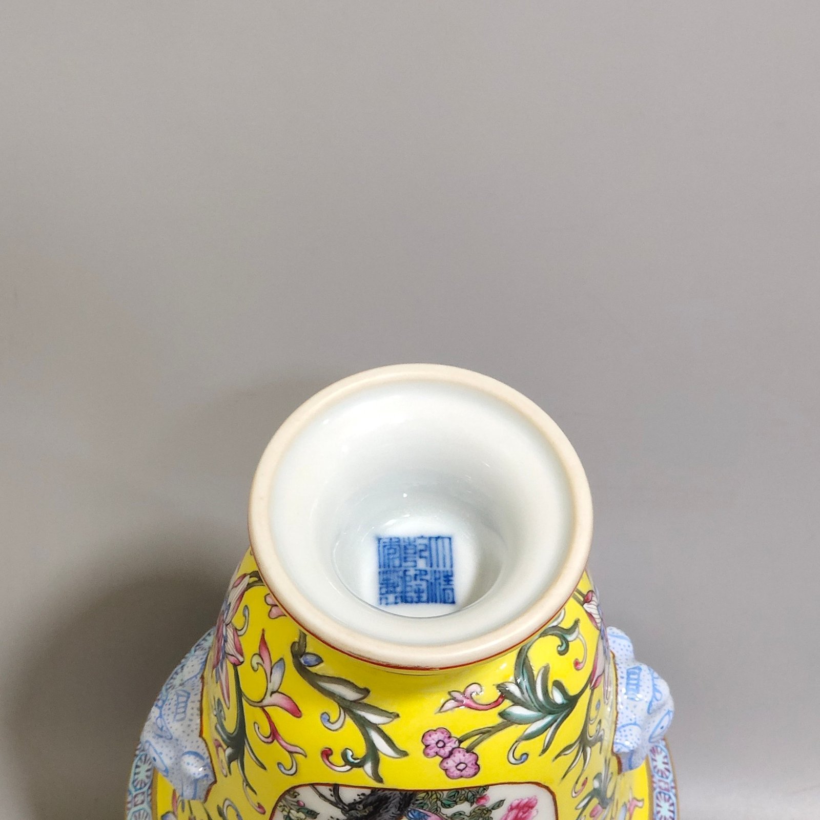 Qing Dynasty Qianlong lemon yellow window flower and bird goblet with two ears