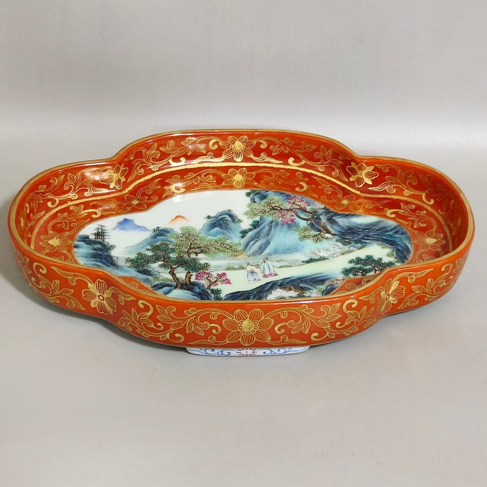 Qing Dynasty Qianlong a coral-red landscape with figures and begonia wash