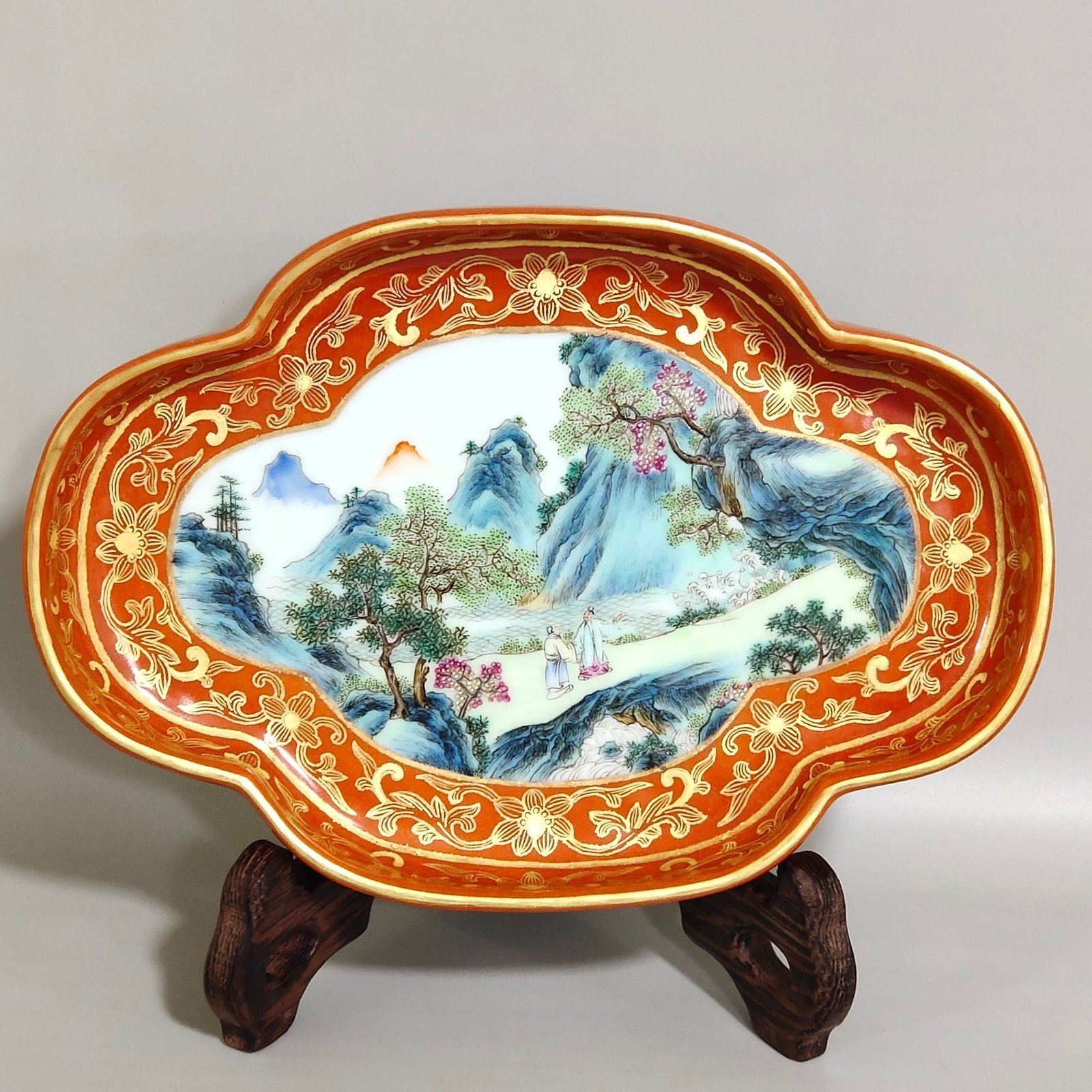 Qing Dynasty Qianlong a coral-red landscape with figures and begonia wash
