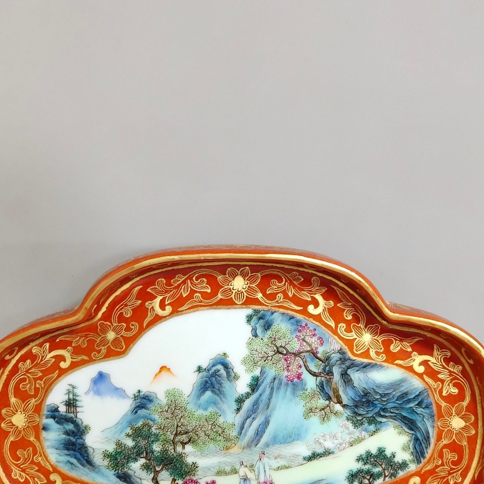 Qing Dynasty Qianlong a coral-red landscape with figures and begonia wash