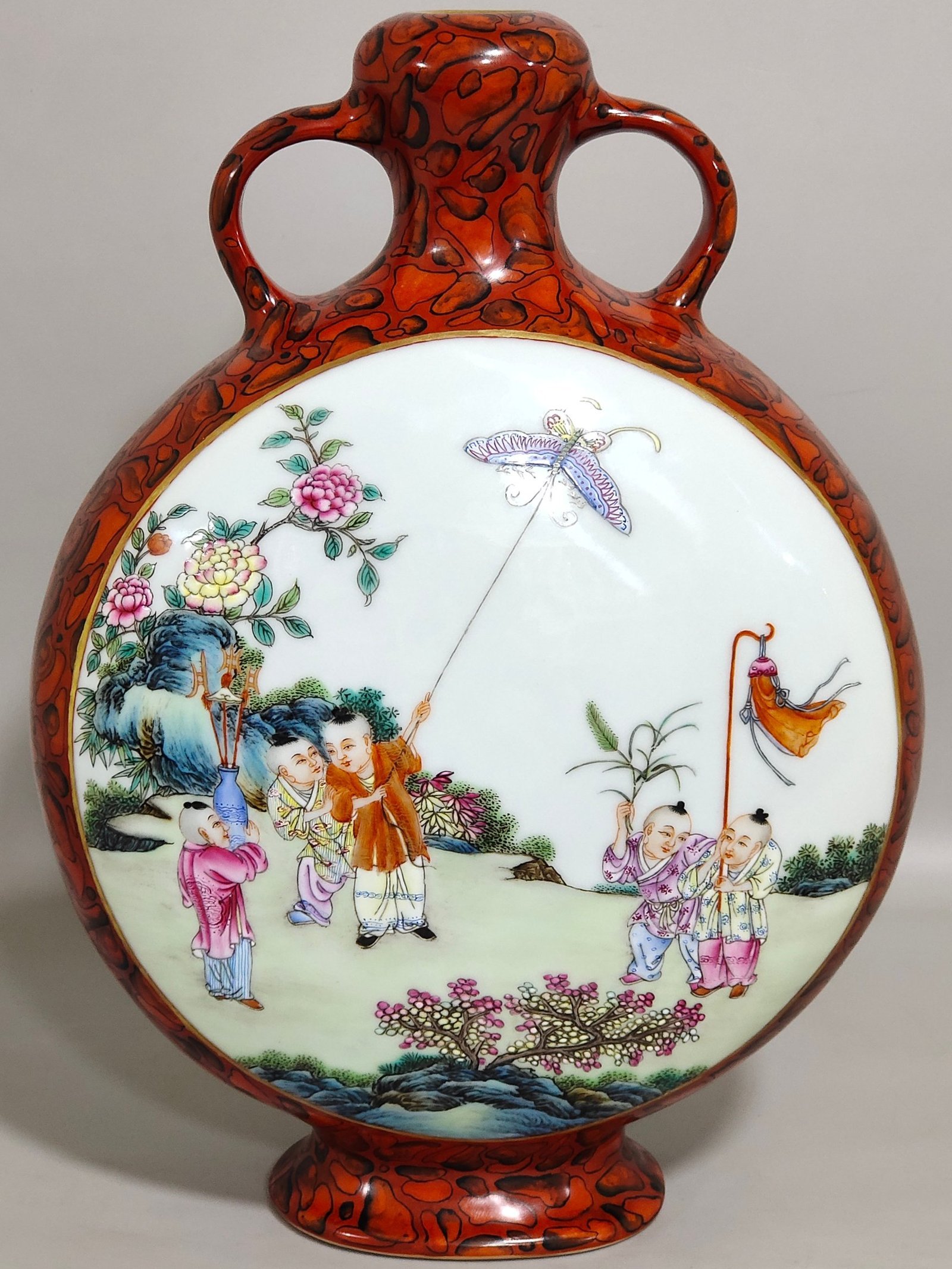 Qing Dynasty Qianlong stone-patterned glazed window vase with baby playing