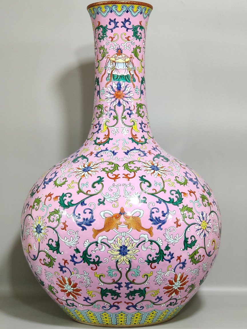 Qing Dynasty Qianlong powder ground with branches and eight treasures pattern vase