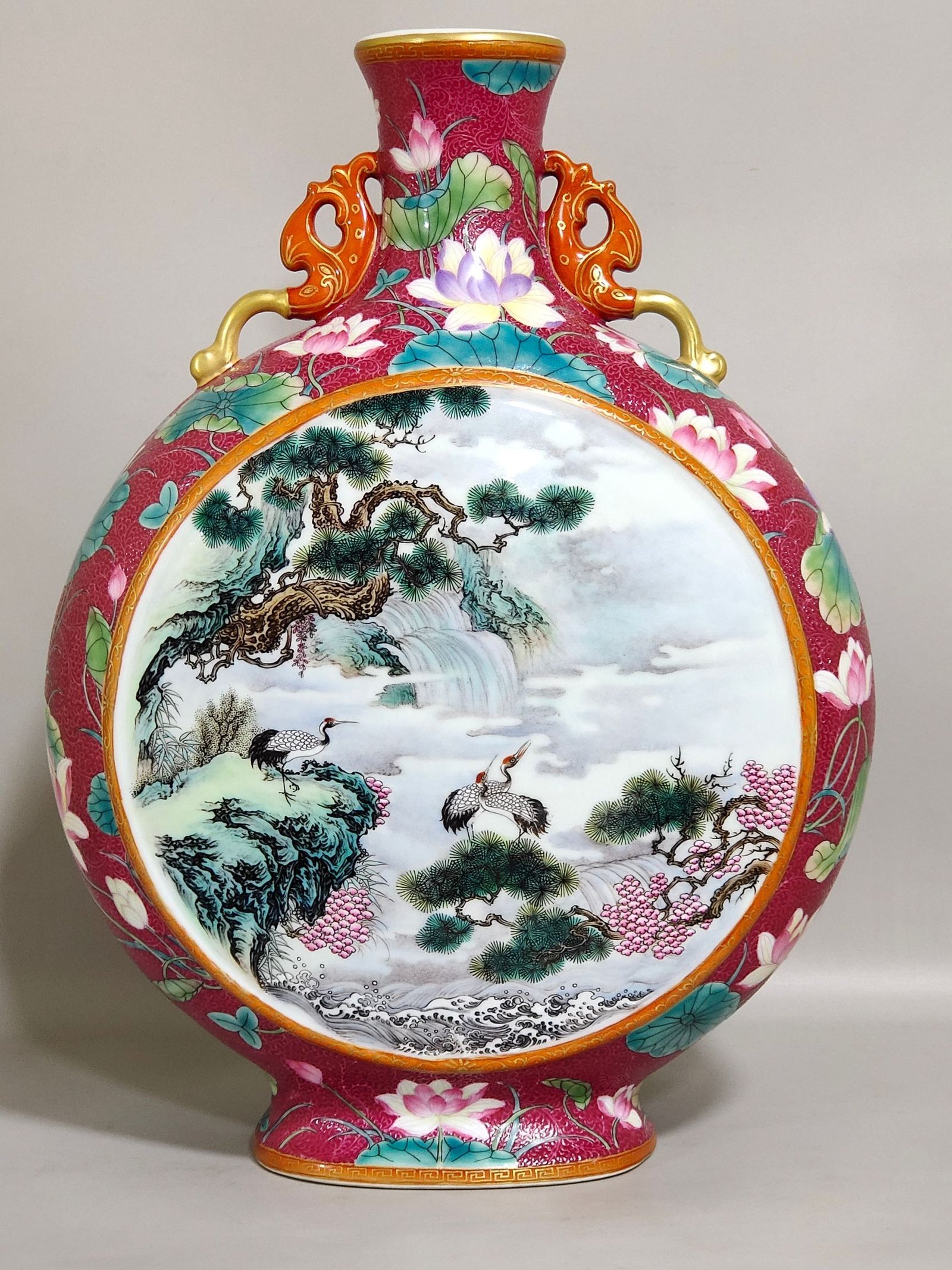 Qing Dynasty Qianlong rouge red grilled lotus window with pines and cranes holding the moon vase