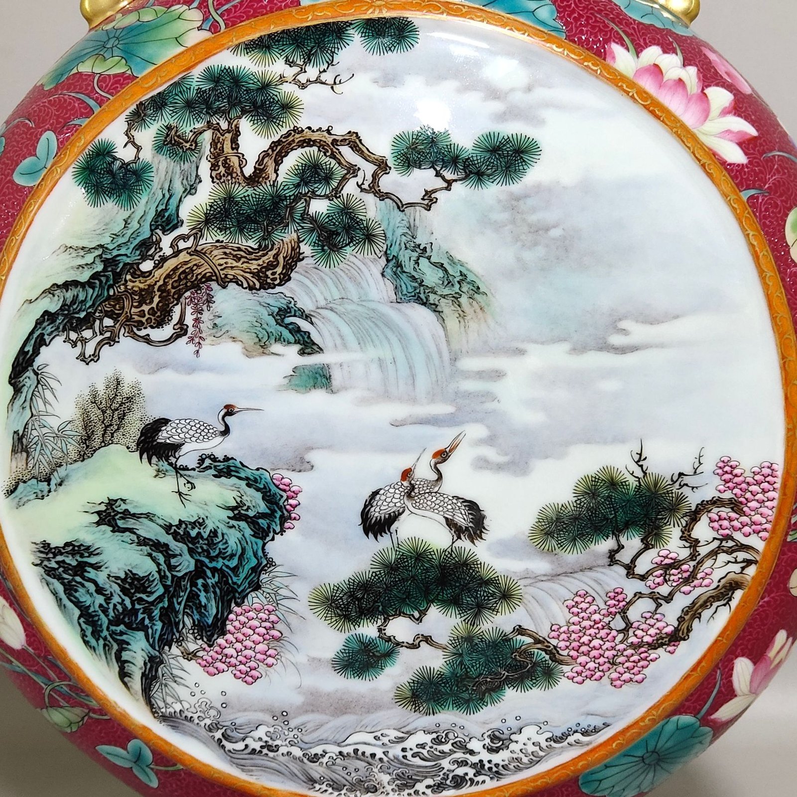 Qing Dynasty Qianlong rouge red grilled lotus window with pines and cranes holding the moon vase