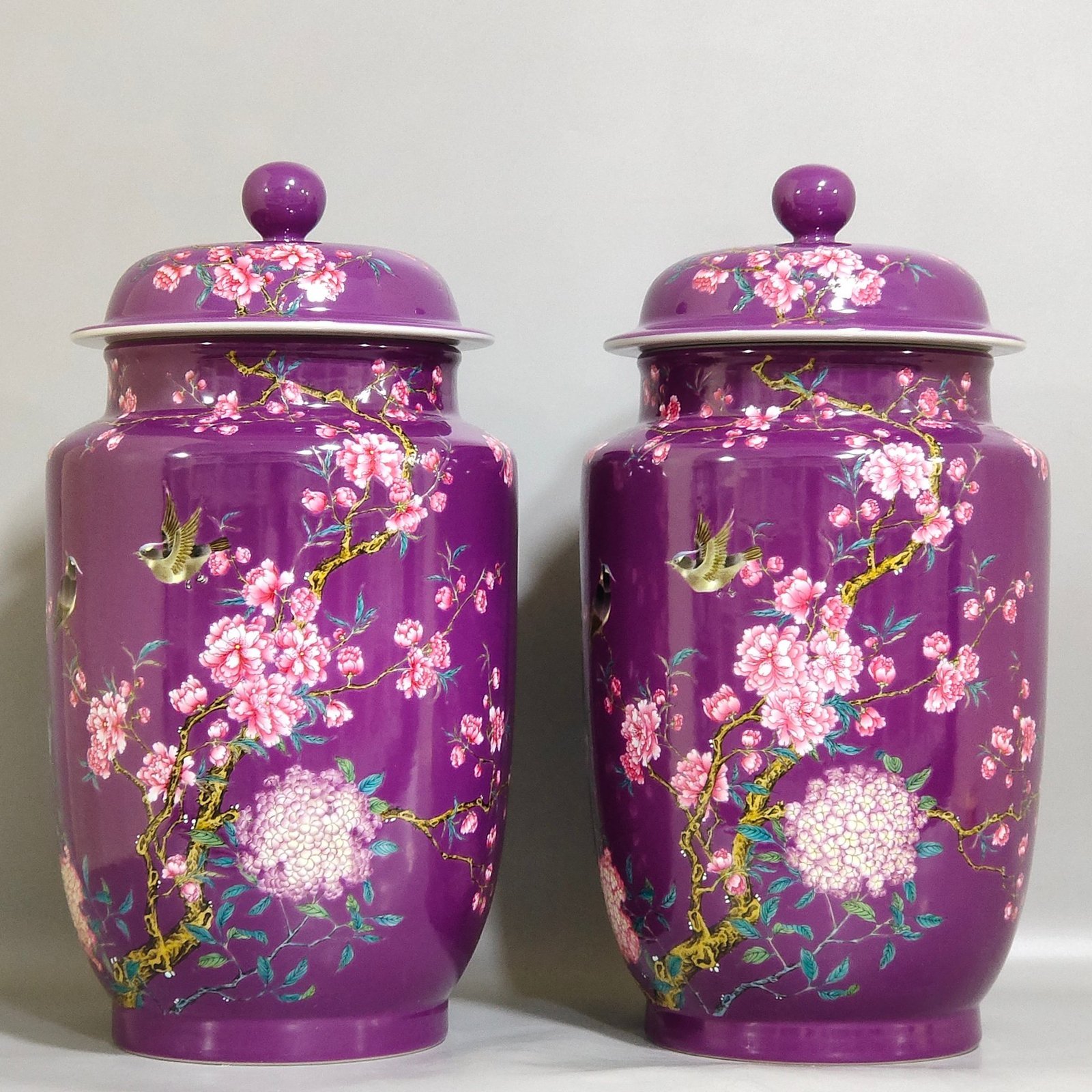 Qing Dynasty Qianlong eggplant skin glazed flower and bird lid jar