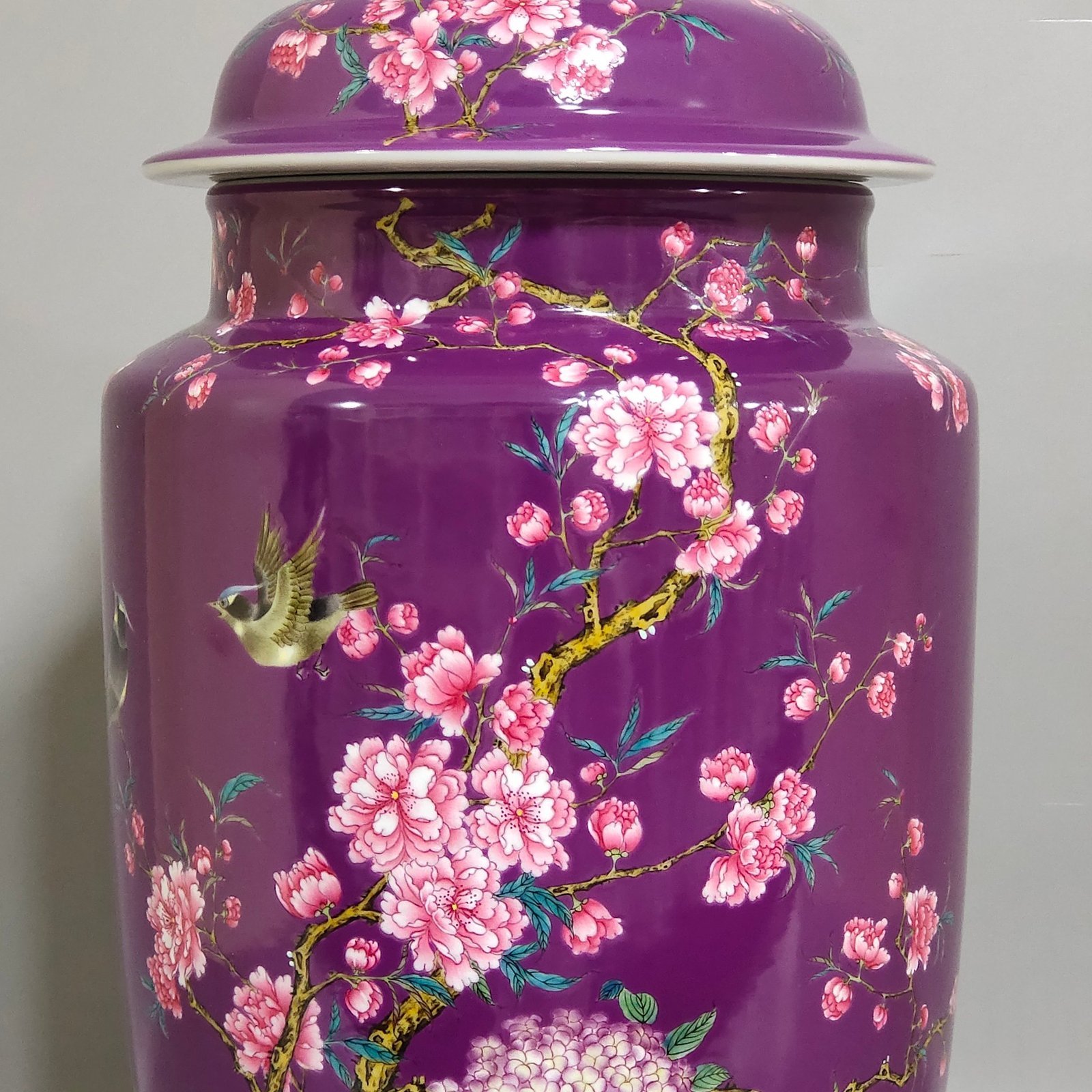 Qing Dynasty Qianlong eggplant skin glazed flower and bird lid jar