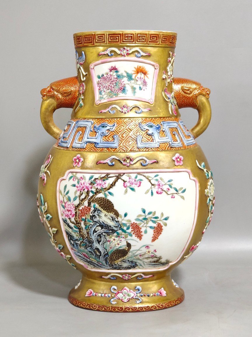 Qing Dynasty Qianlong a gold-plated windowed quail reed wild goose and elephant ear vase