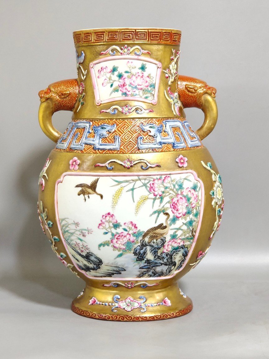 Qing Dynasty Qianlong a gold-plated windowed quail reed wild goose and elephant ear vase