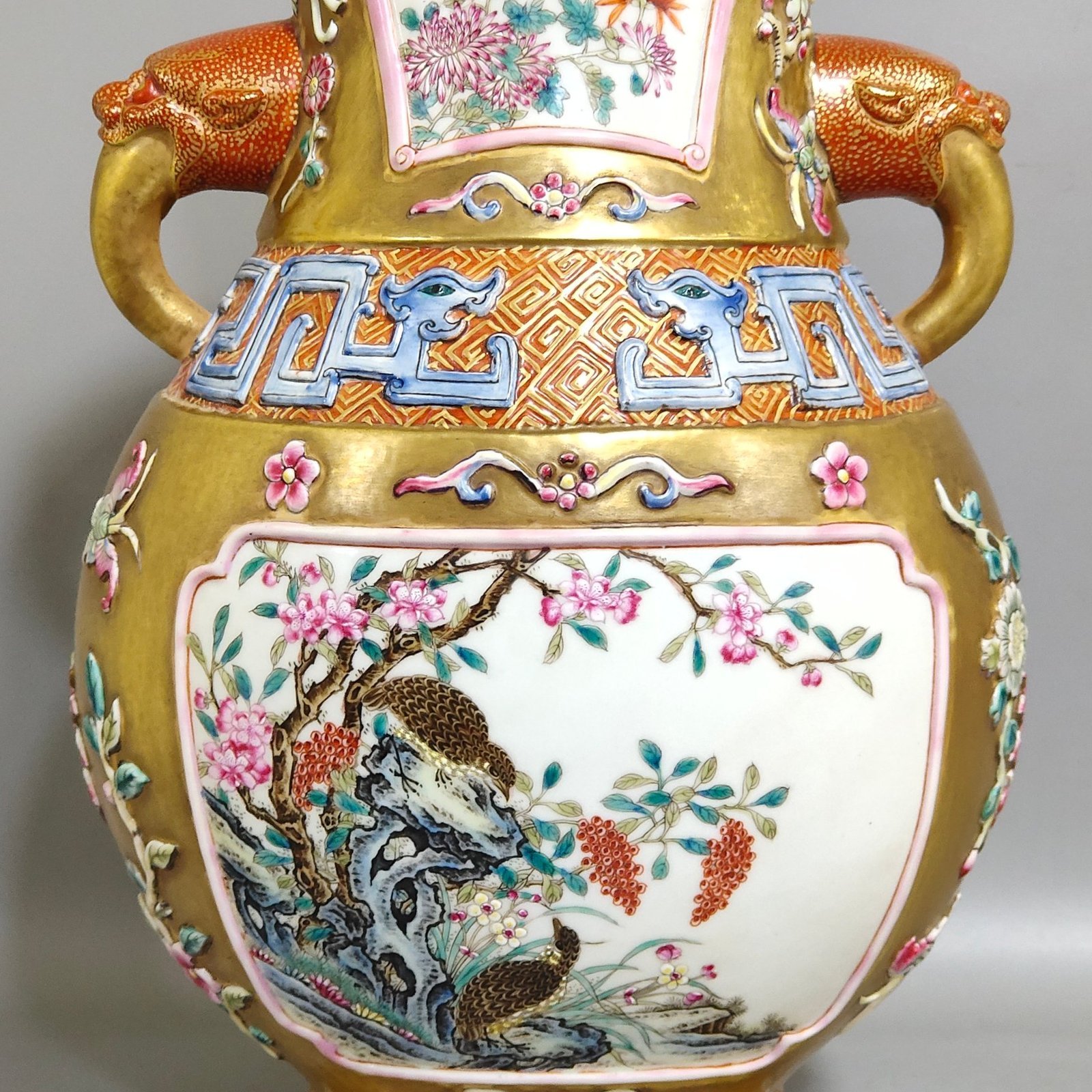 Qing Dynasty Qianlong a gold-plated windowed quail reed wild goose and elephant ear vase