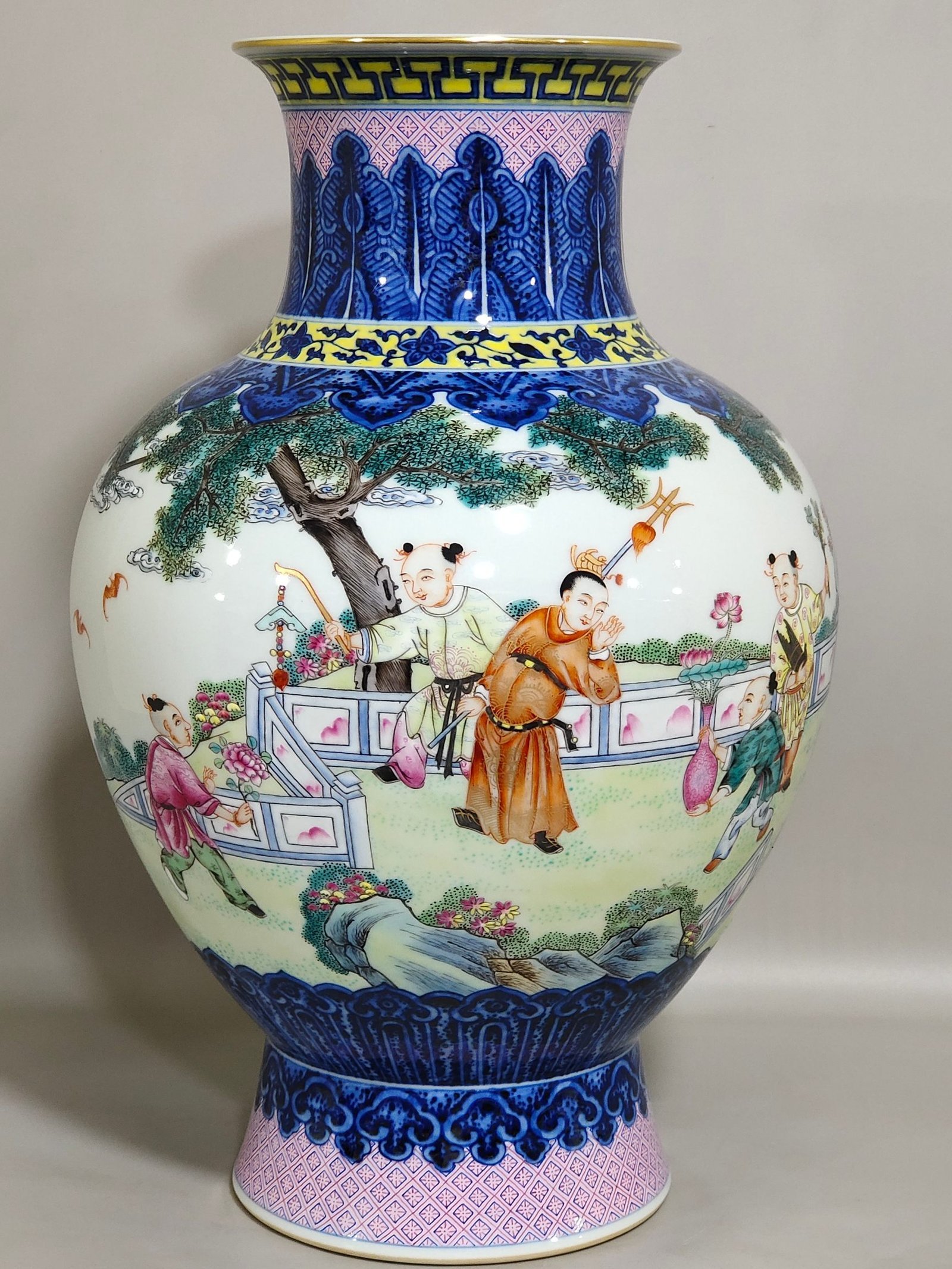 Qing Dynasty Qianlong blue and white and pastel figure boy vase