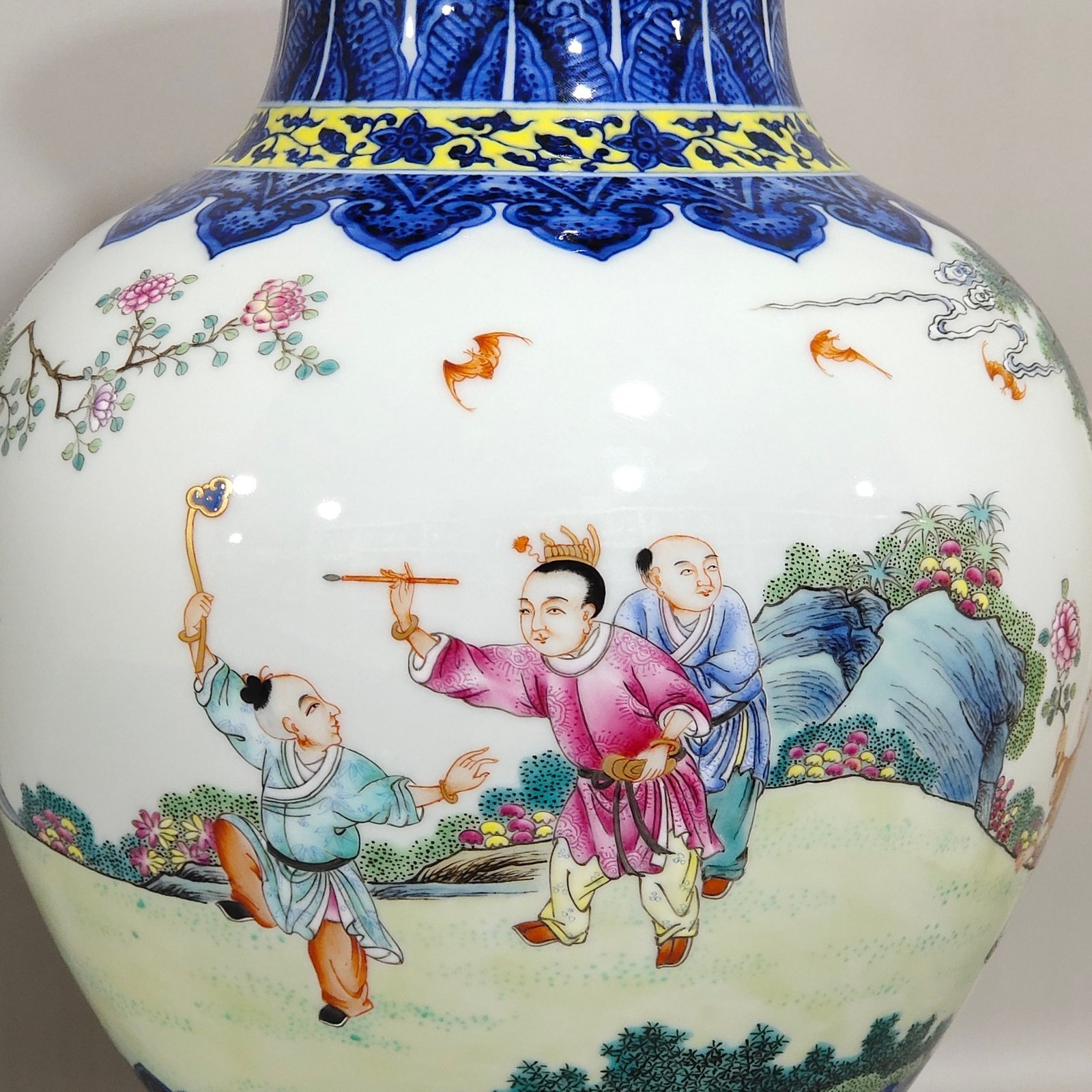 Qing Dynasty Qianlong blue and white and pastel figure boy vase
