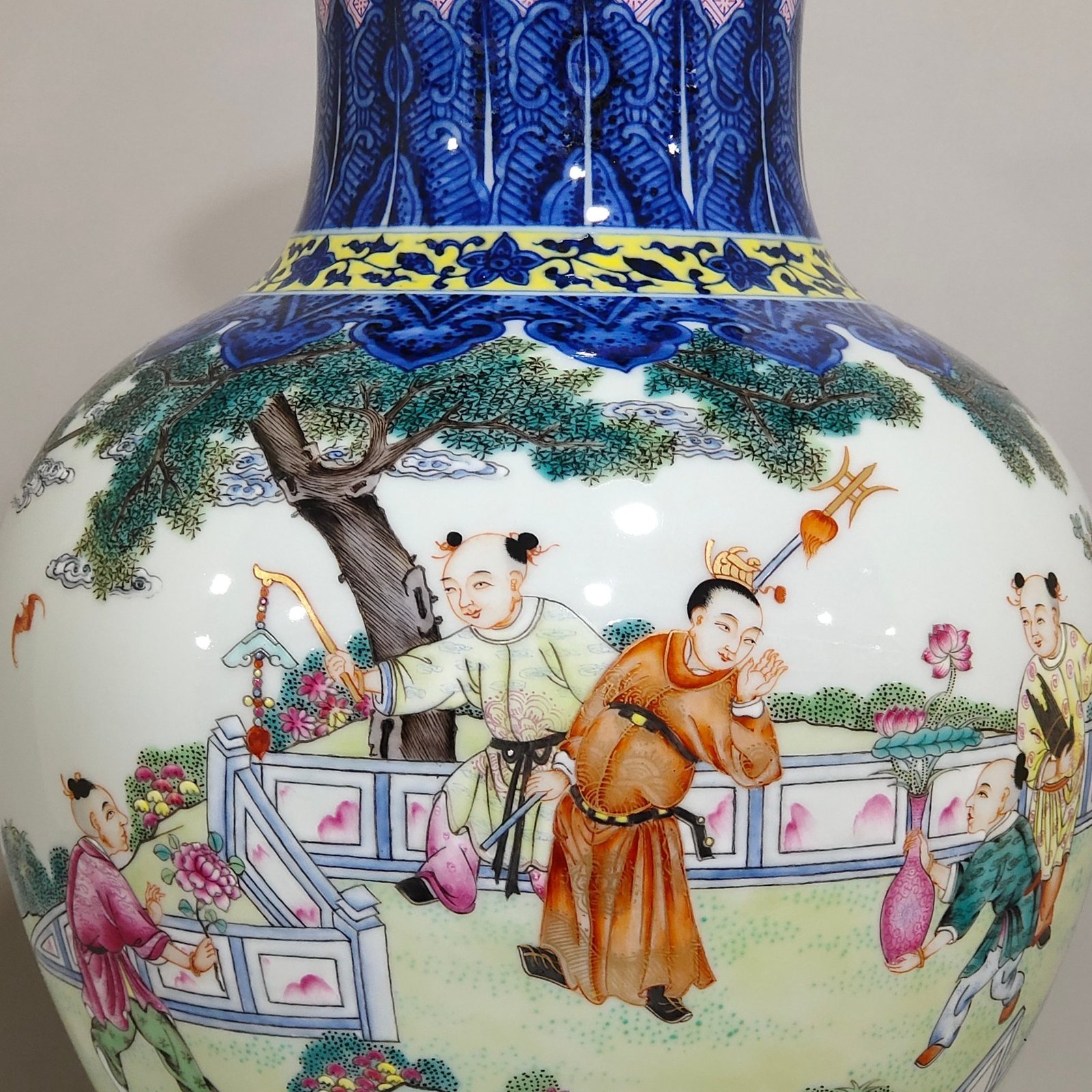 Qing Dynasty Qianlong blue and white and pastel figure boy vase