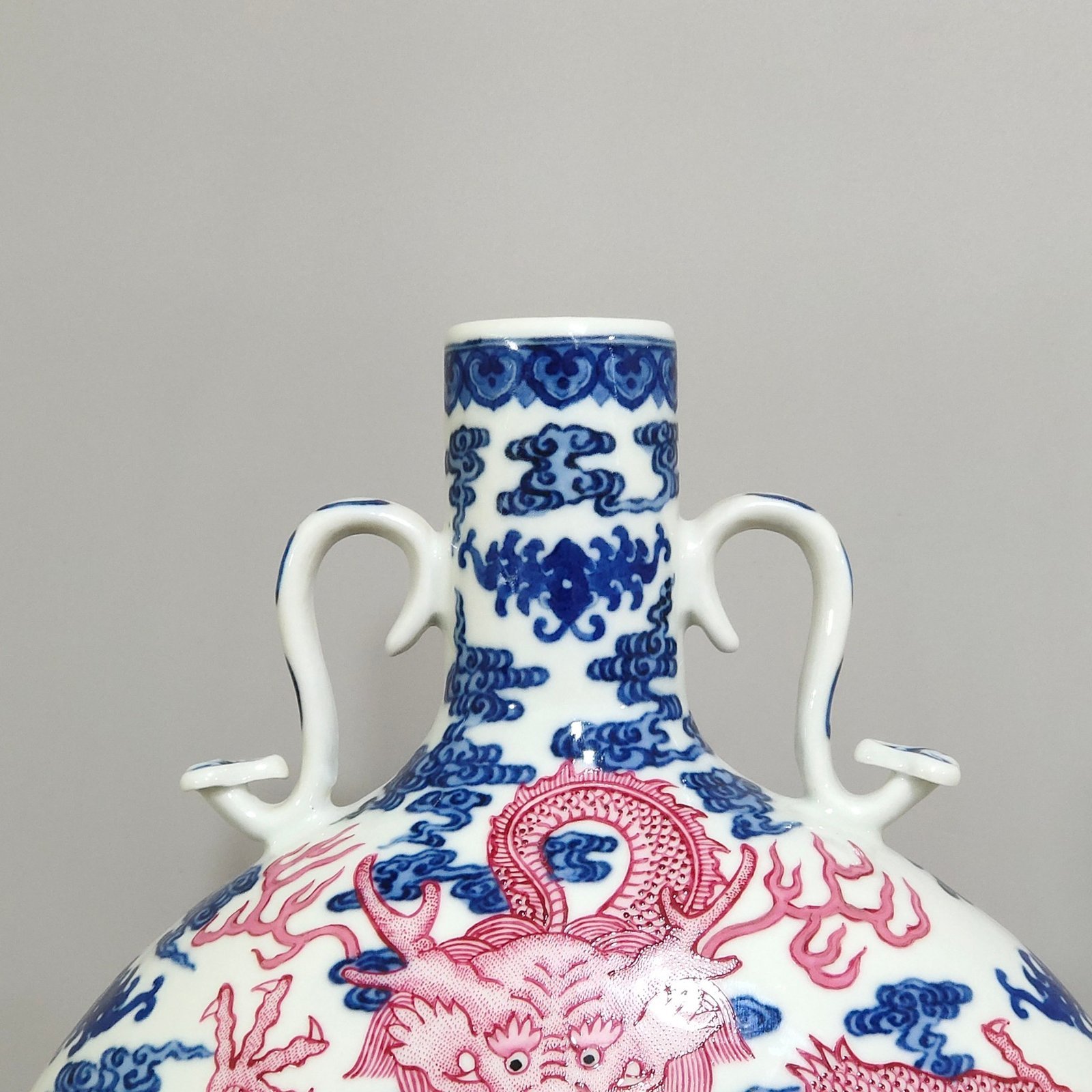 Qing Dynasty Qianlong blue and white and rouge red auspicious cloud and dragon pattern moon-holding vase