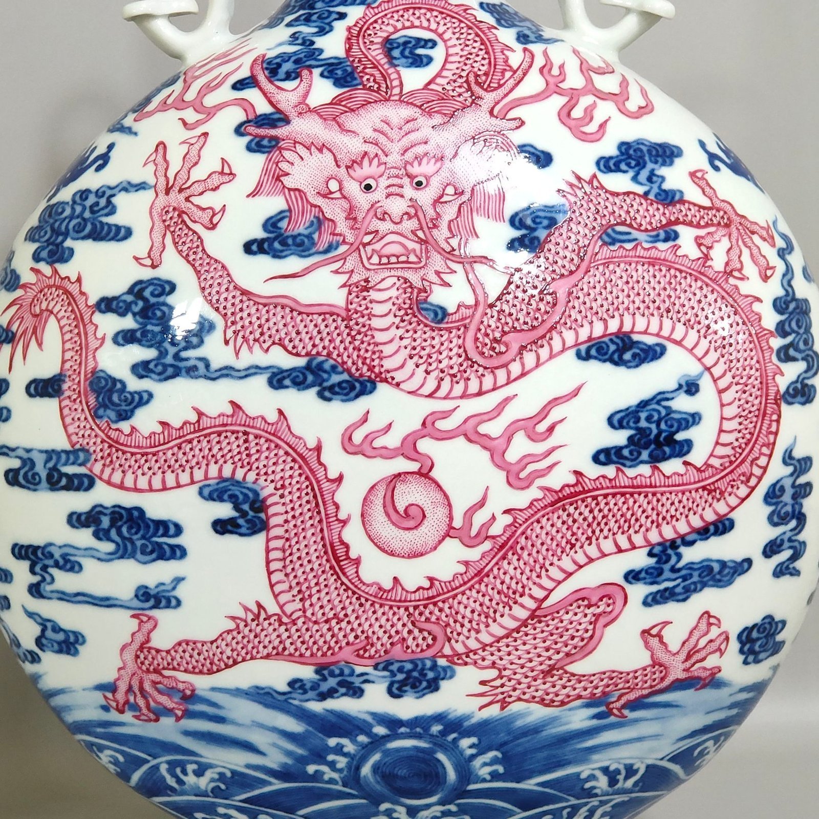Qing Dynasty Qianlong blue and white and rouge red auspicious cloud and dragon pattern moon-holding vase