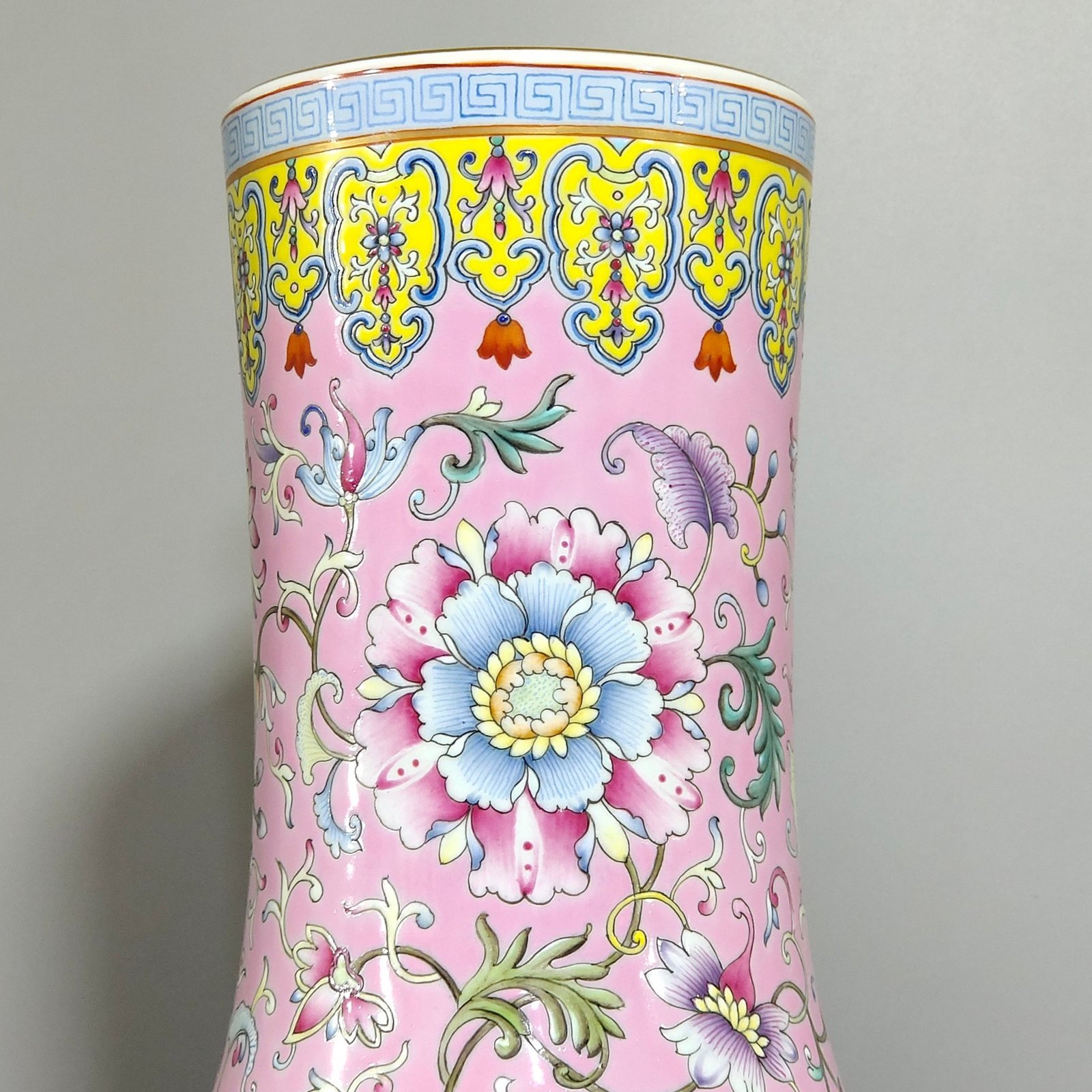 Qing Dynasty Yongzheng celestial sphere vase with pink ground flowers and windows
