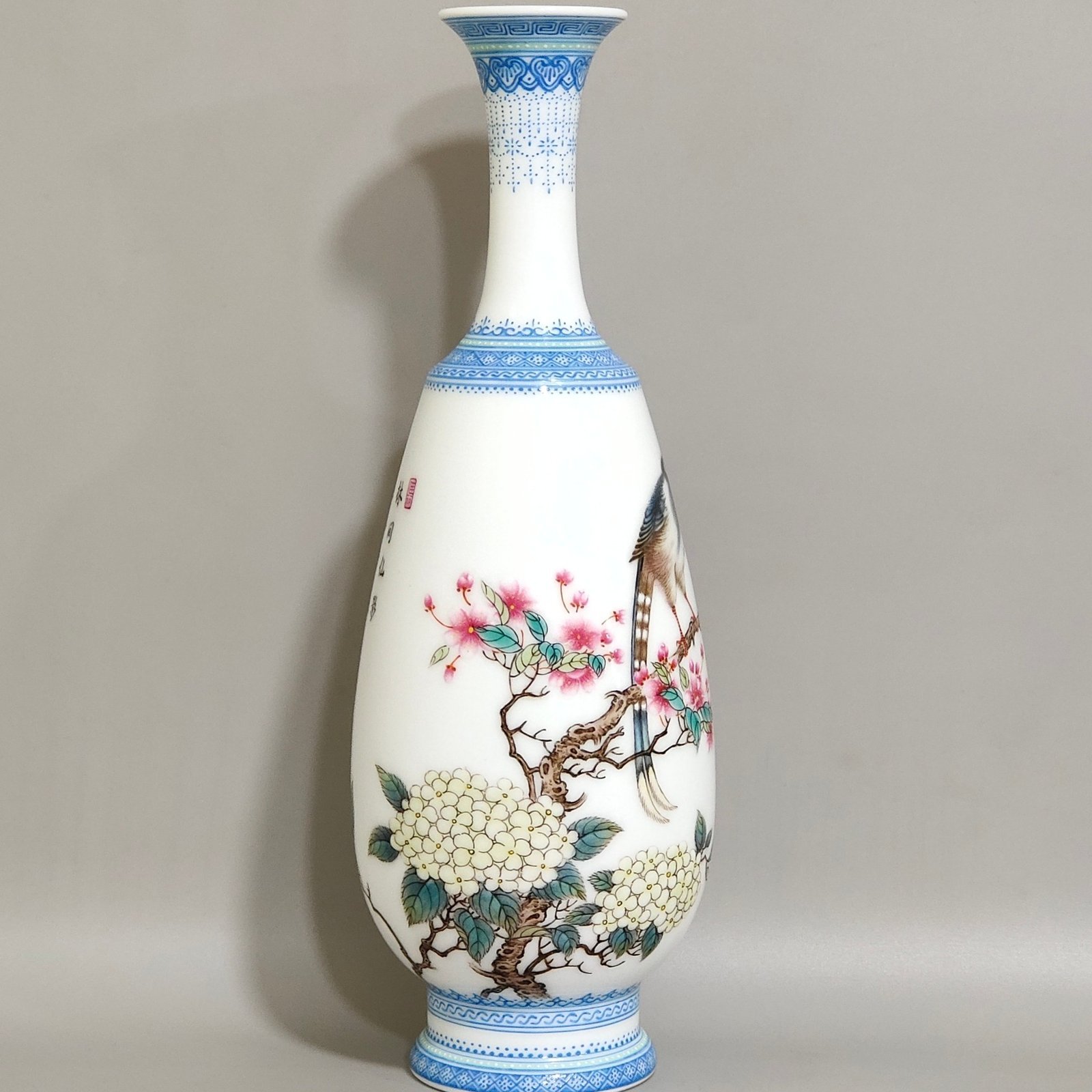 Qing Dynasty Yongzheng enamel vase with green edging and poems inscribed with flowers and birds