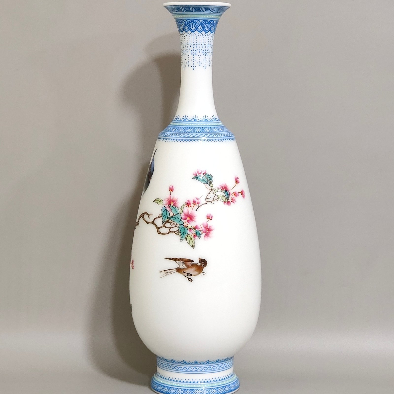 Qing Dynasty Yongzheng enamel vase with green edging and poems inscribed with flowers and birds