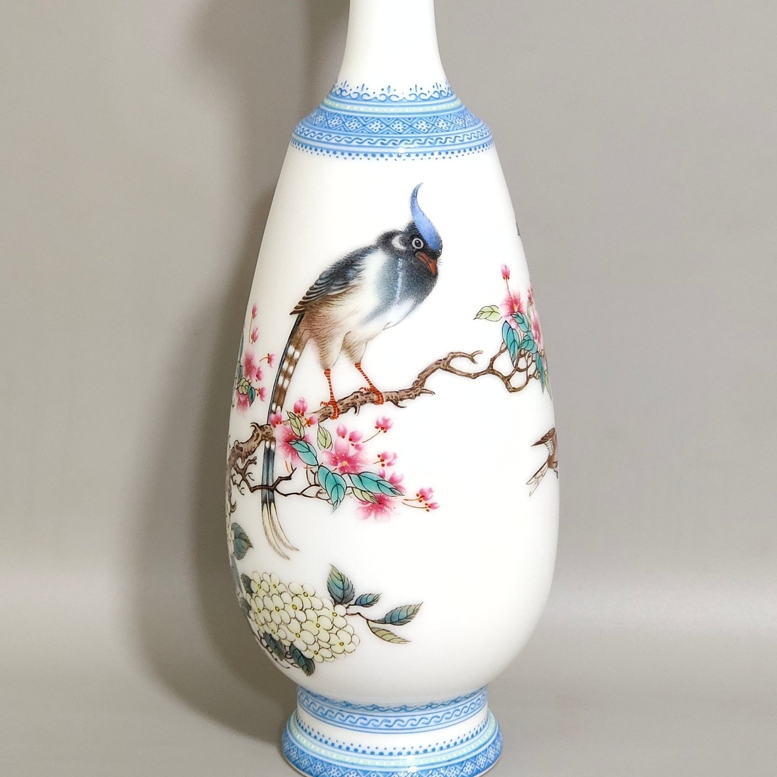 Qing Dynasty Yongzheng enamel vase with green edging and poems inscribed with flowers and birds