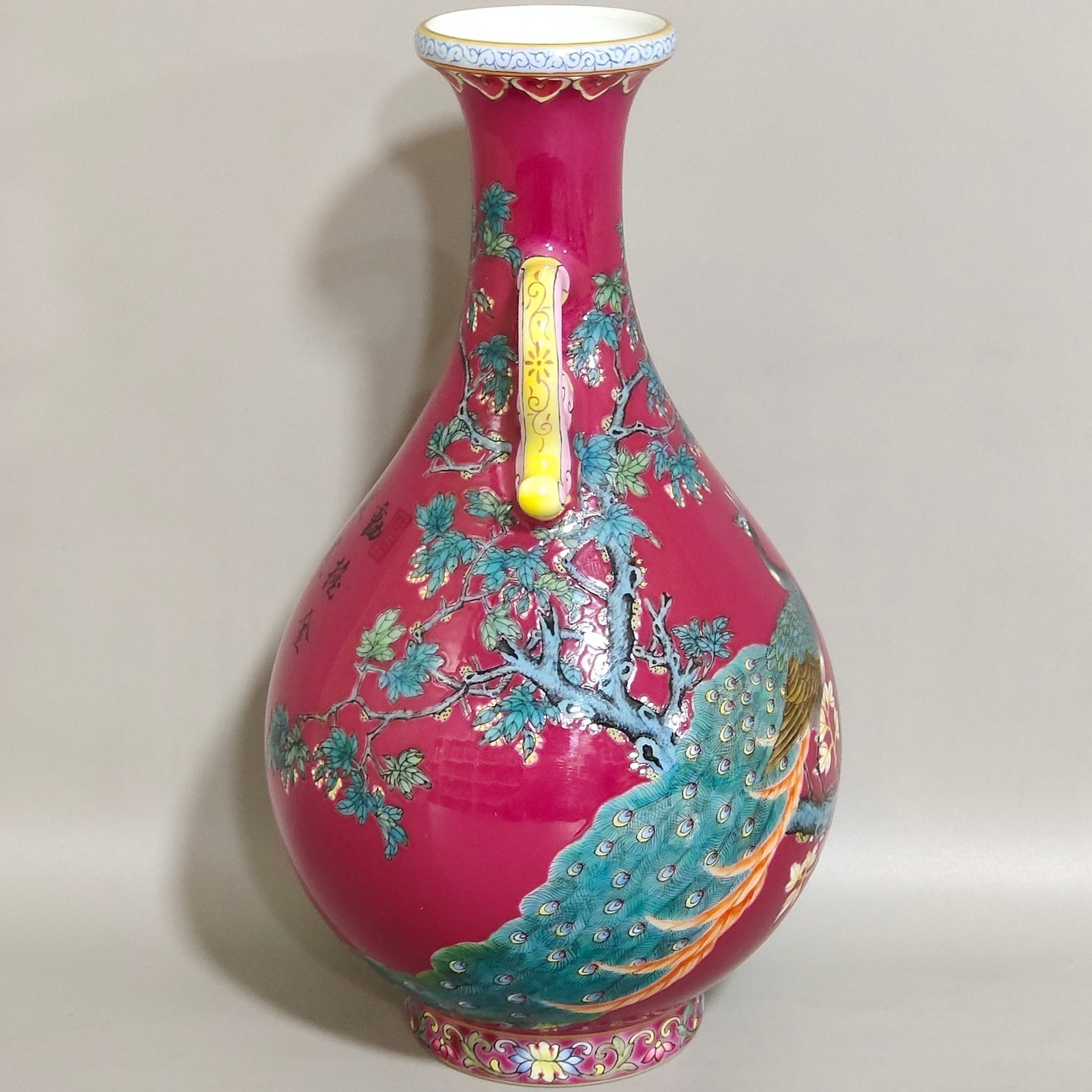 Qing Dynasty Yongzheng A rouge-red peacock with double-eared jade vase