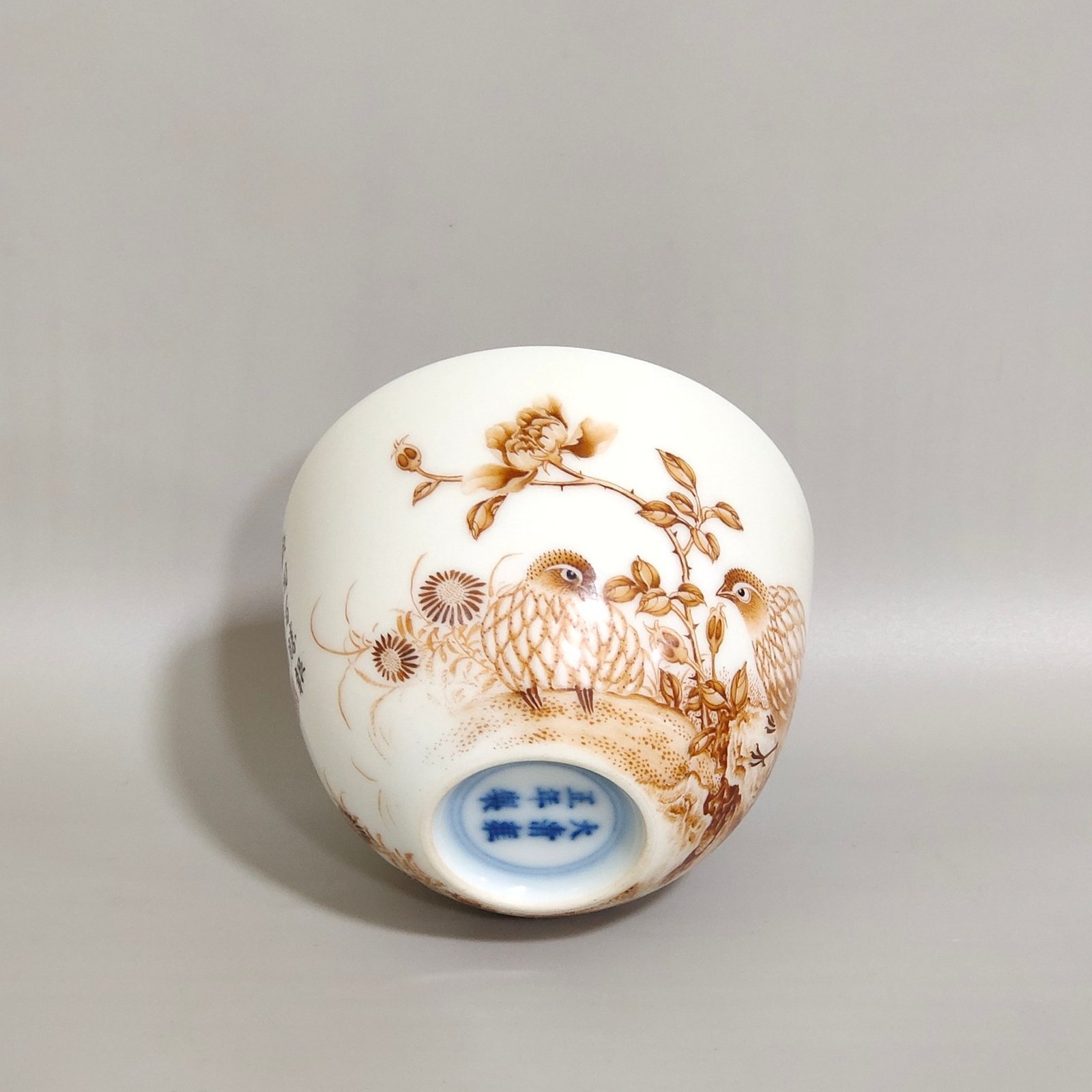Qing Dynasty Yongzheng alum red cup inscribed with poems about living and working