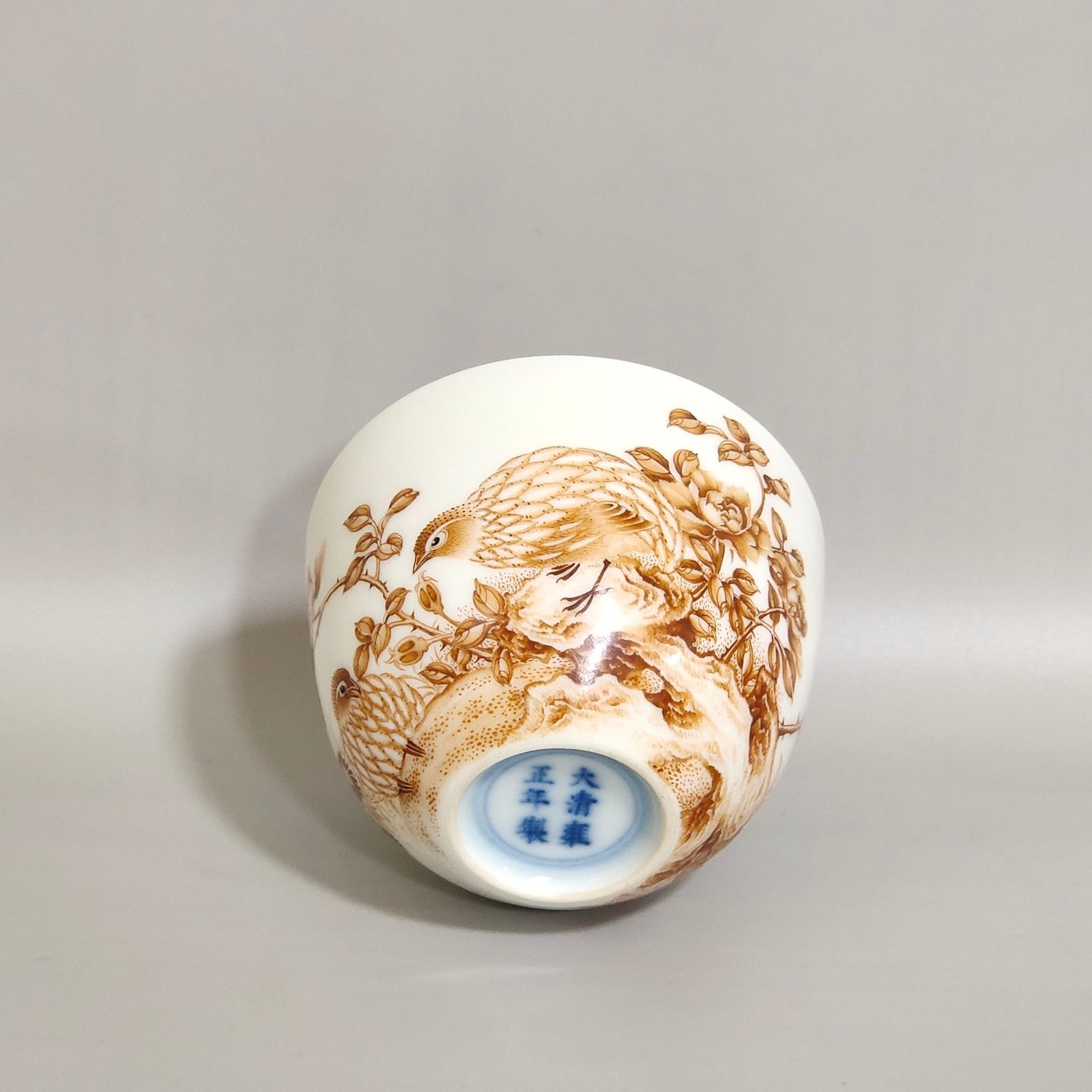Qing Dynasty Yongzheng alum red cup inscribed with poems about living and working