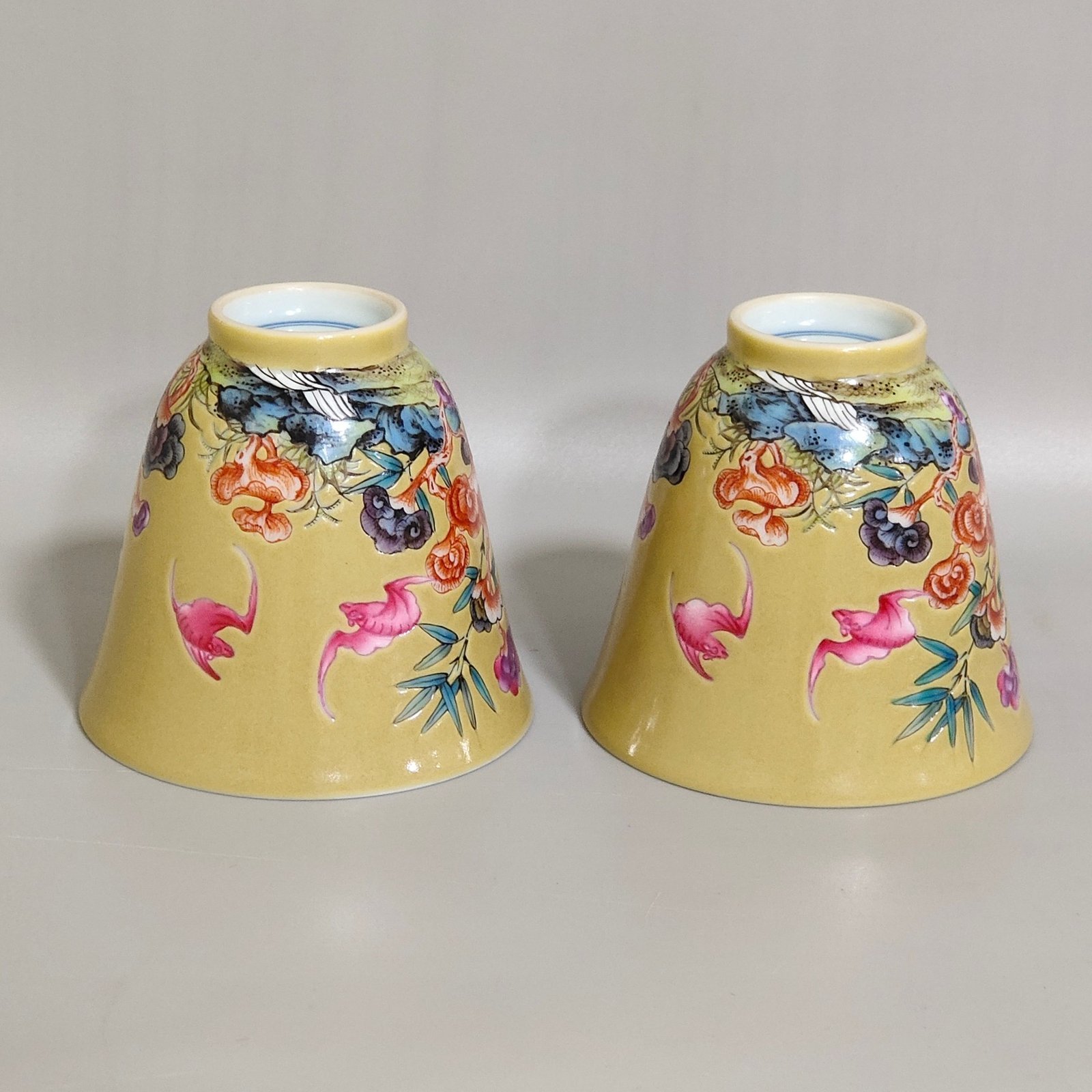 Qing Dynasty Yongzheng beige glazed bat cup with bamboo and stone patterns