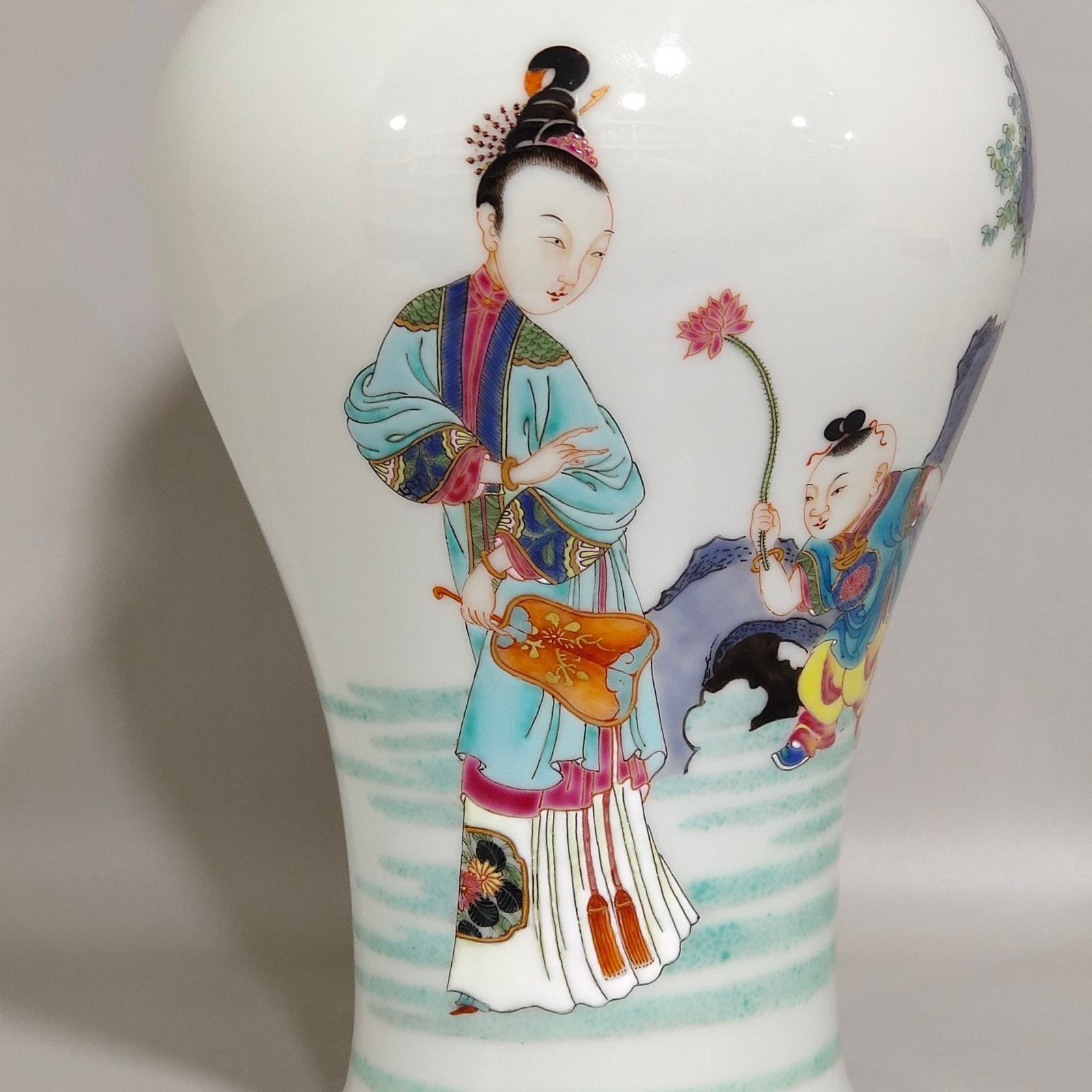 Qing Dynasty Yongzheng pastel plum vase depicting a lady playing with her baby