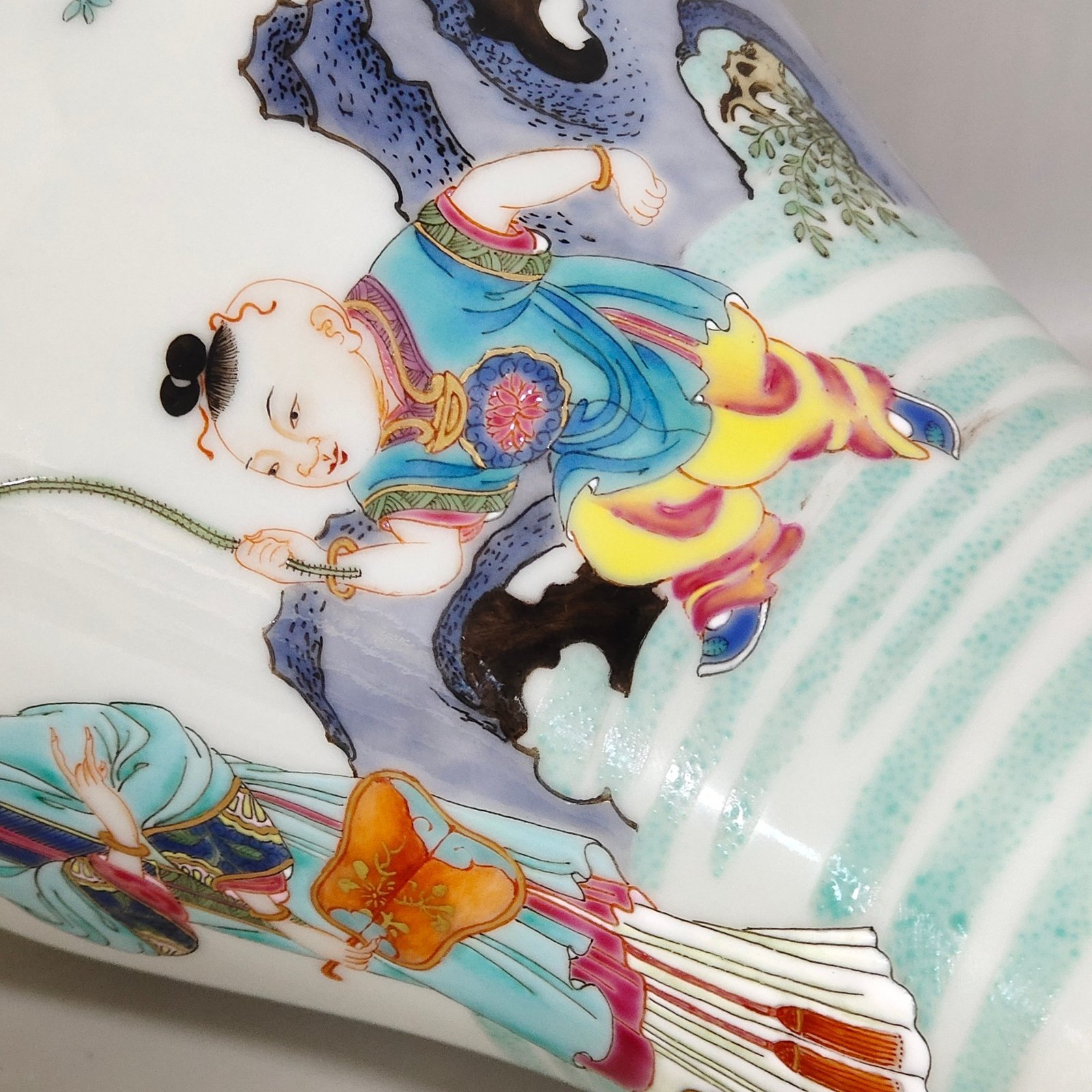Qing Dynasty Yongzheng pastel plum vase depicting a lady playing with her baby