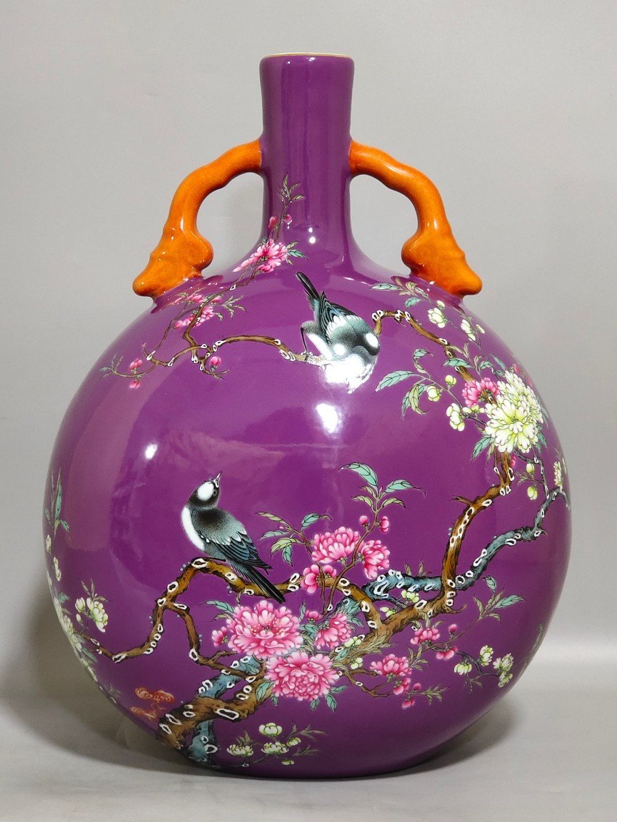 Qing Dynasty Yongzheng purple-glazed eggplant skin flower and bird holding the moon vase