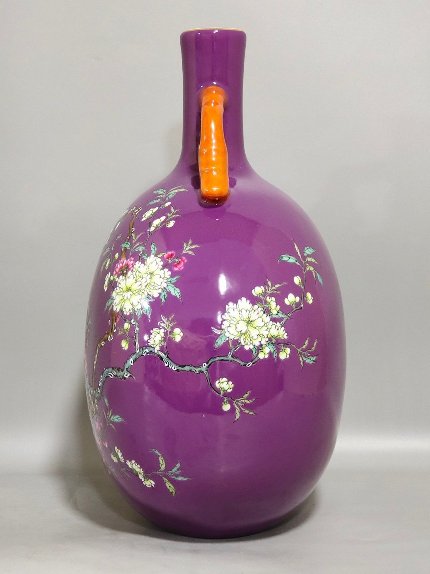 Qing Dynasty Yongzheng purple-glazed eggplant skin flower and bird holding the moon vase