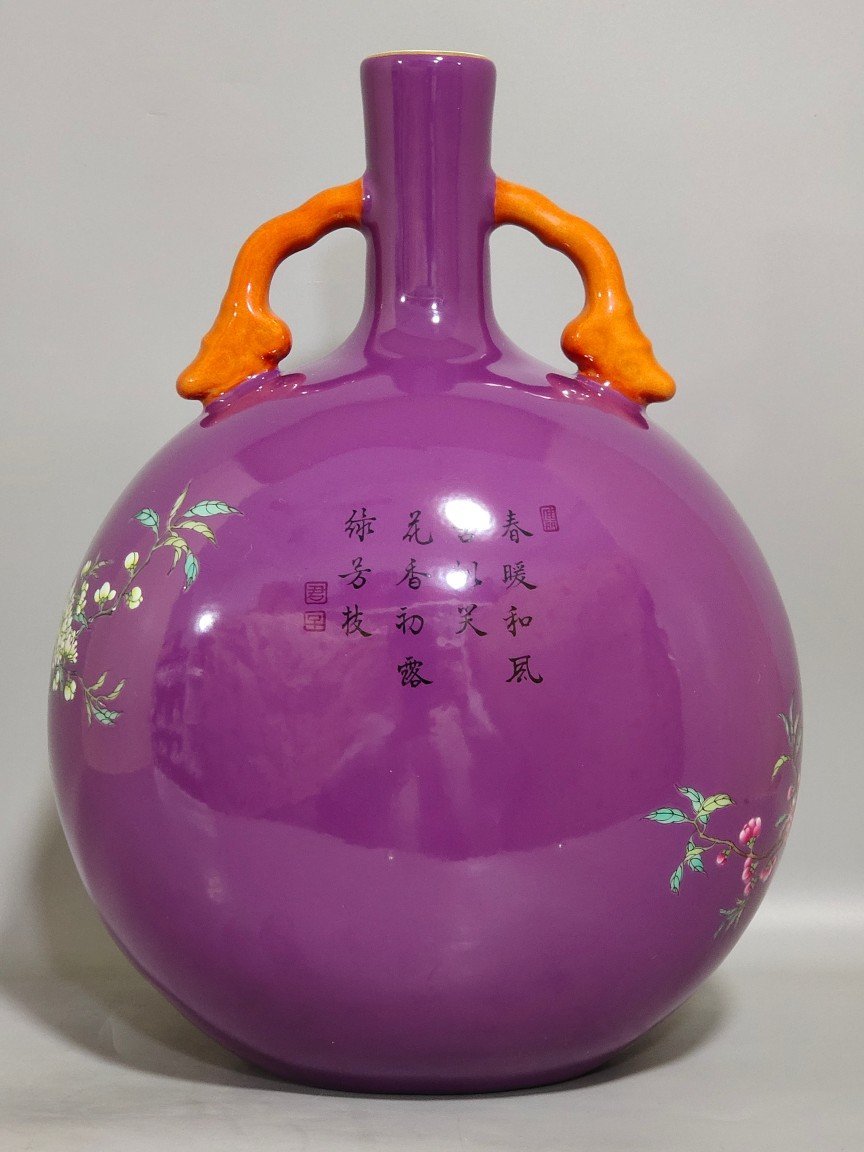 Qing Dynasty Yongzheng purple-glazed eggplant skin flower and bird holding the moon vase