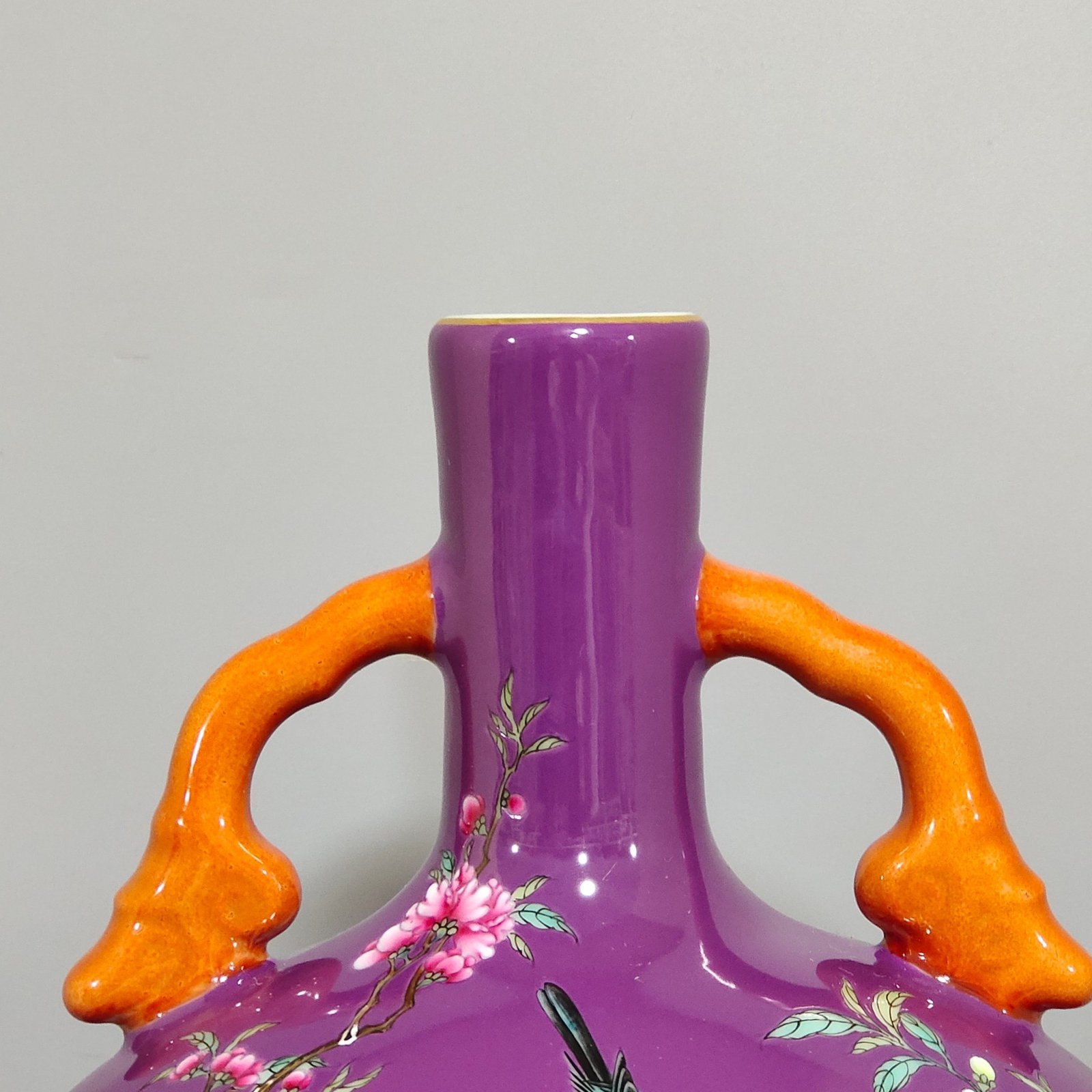 Qing Dynasty Yongzheng purple-glazed eggplant skin flower and bird holding the moon vase