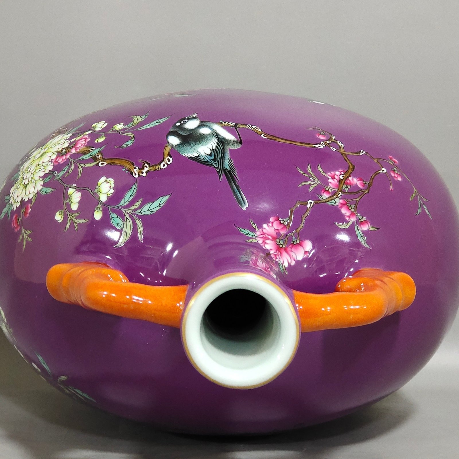 Qing Dynasty Yongzheng purple-glazed eggplant skin flower and bird holding the moon vase