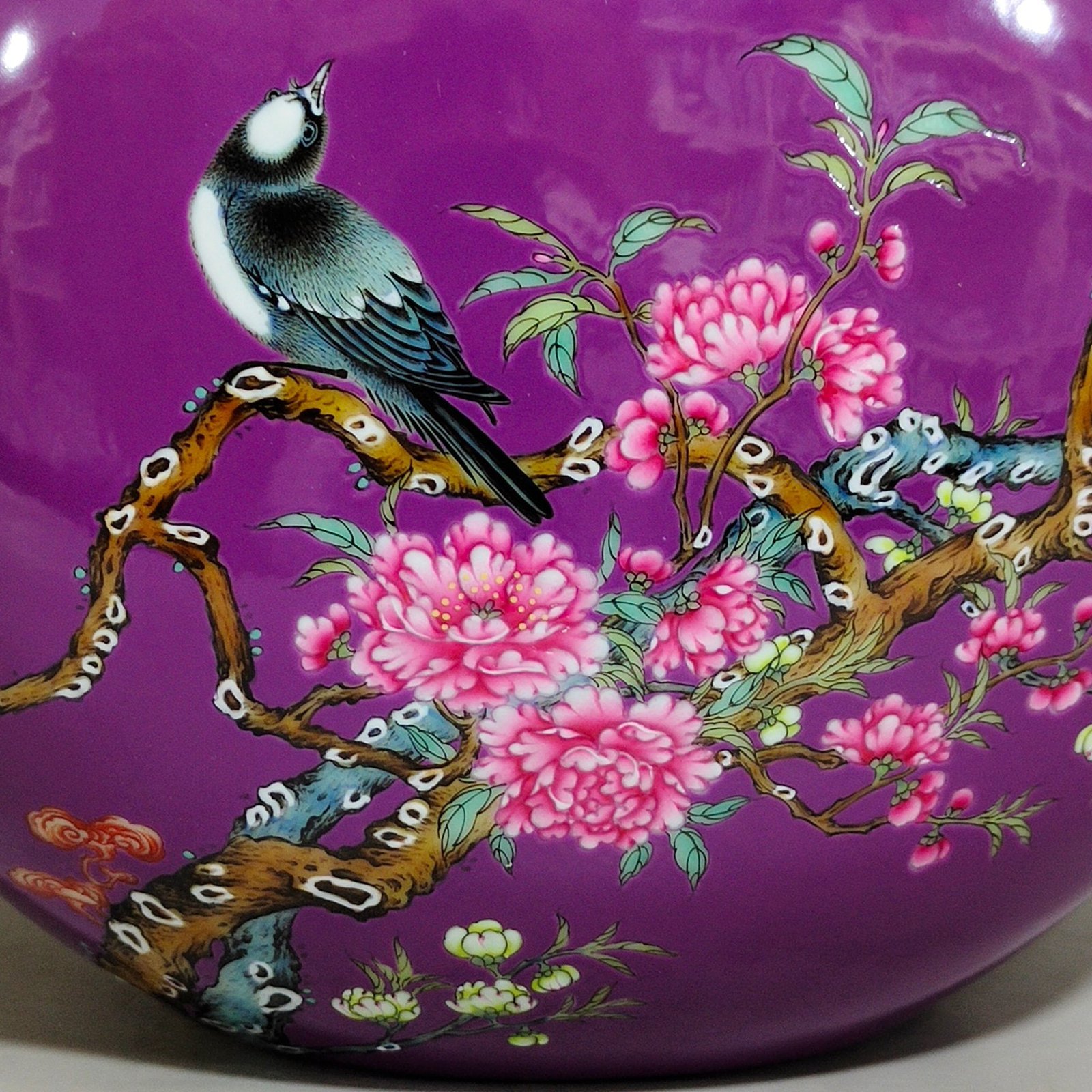 Qing Dynasty Yongzheng purple-glazed eggplant skin flower and bird holding the moon vase