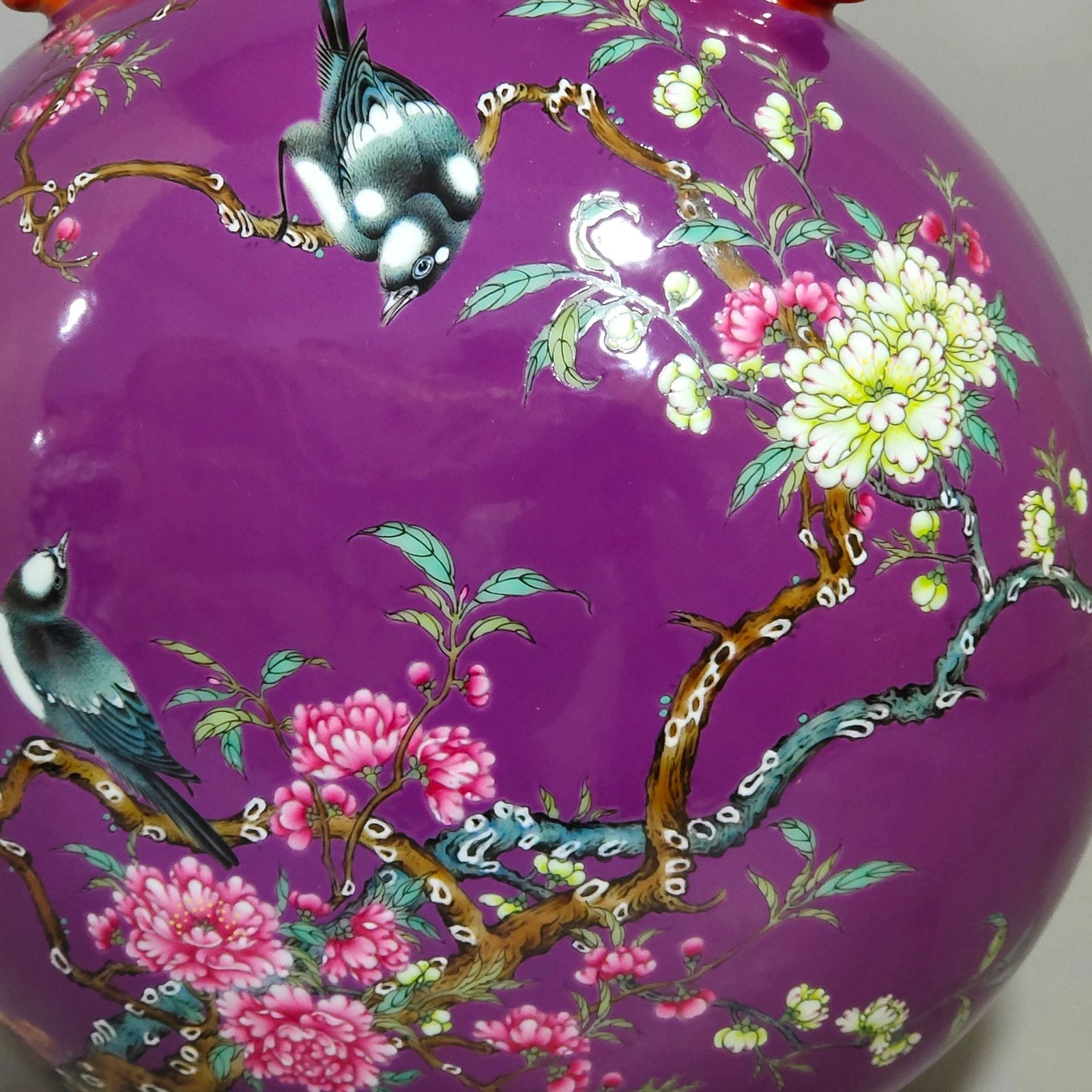 Qing Dynasty Yongzheng purple-glazed eggplant skin flower and bird holding the moon vase